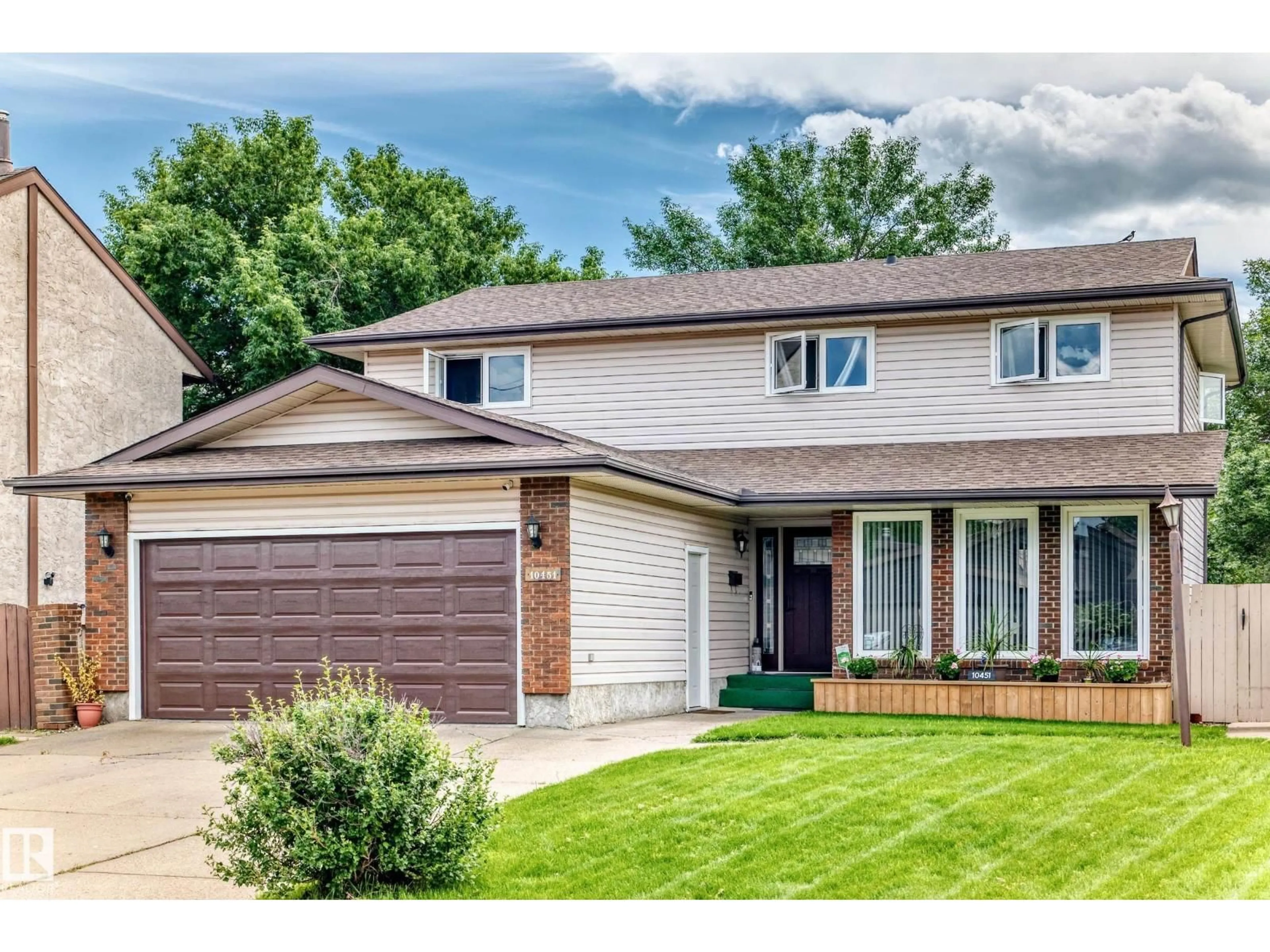 Home with vinyl exterior material, street for 10451 26 AV, Edmonton Alberta T6J4K1