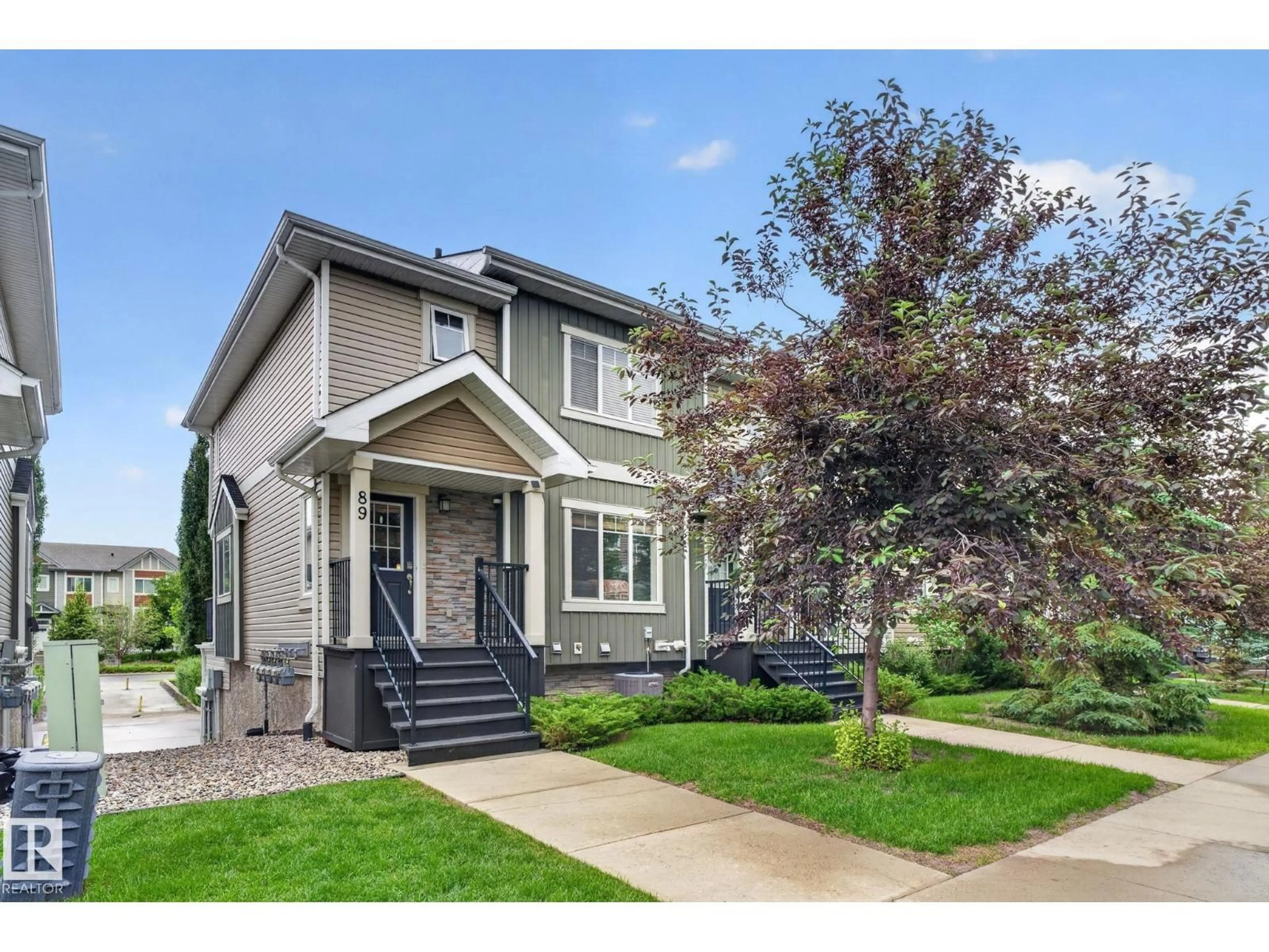 Home with vinyl exterior material, street for 89 9535 217 ST NW, Edmonton Alberta T5T4P5