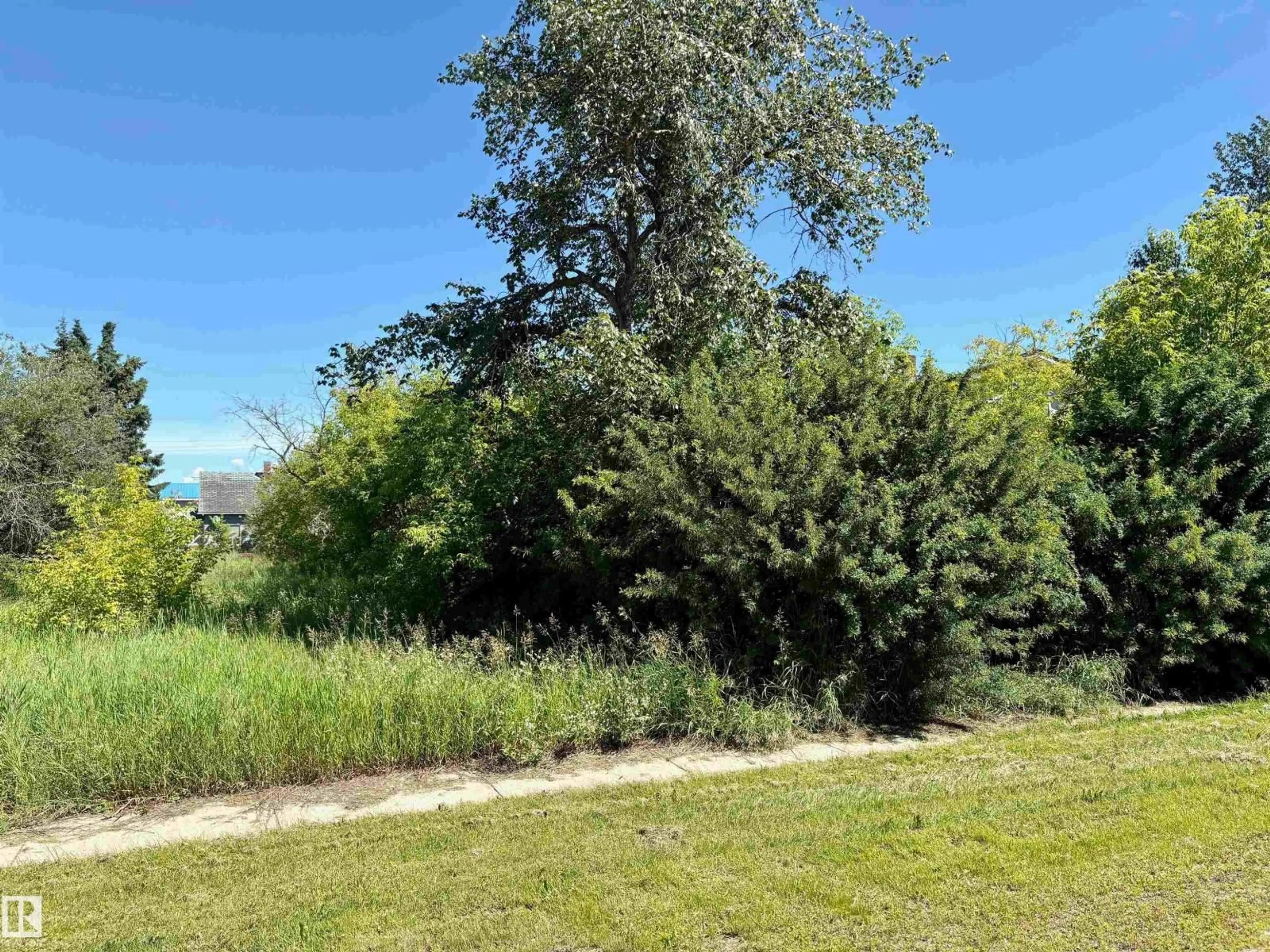A pic from outside/outdoor area/front of a property/back of a property/a pic from drone, forest/trees view for 5216 & 5618 50 AV, Therien Alberta T0A1P0