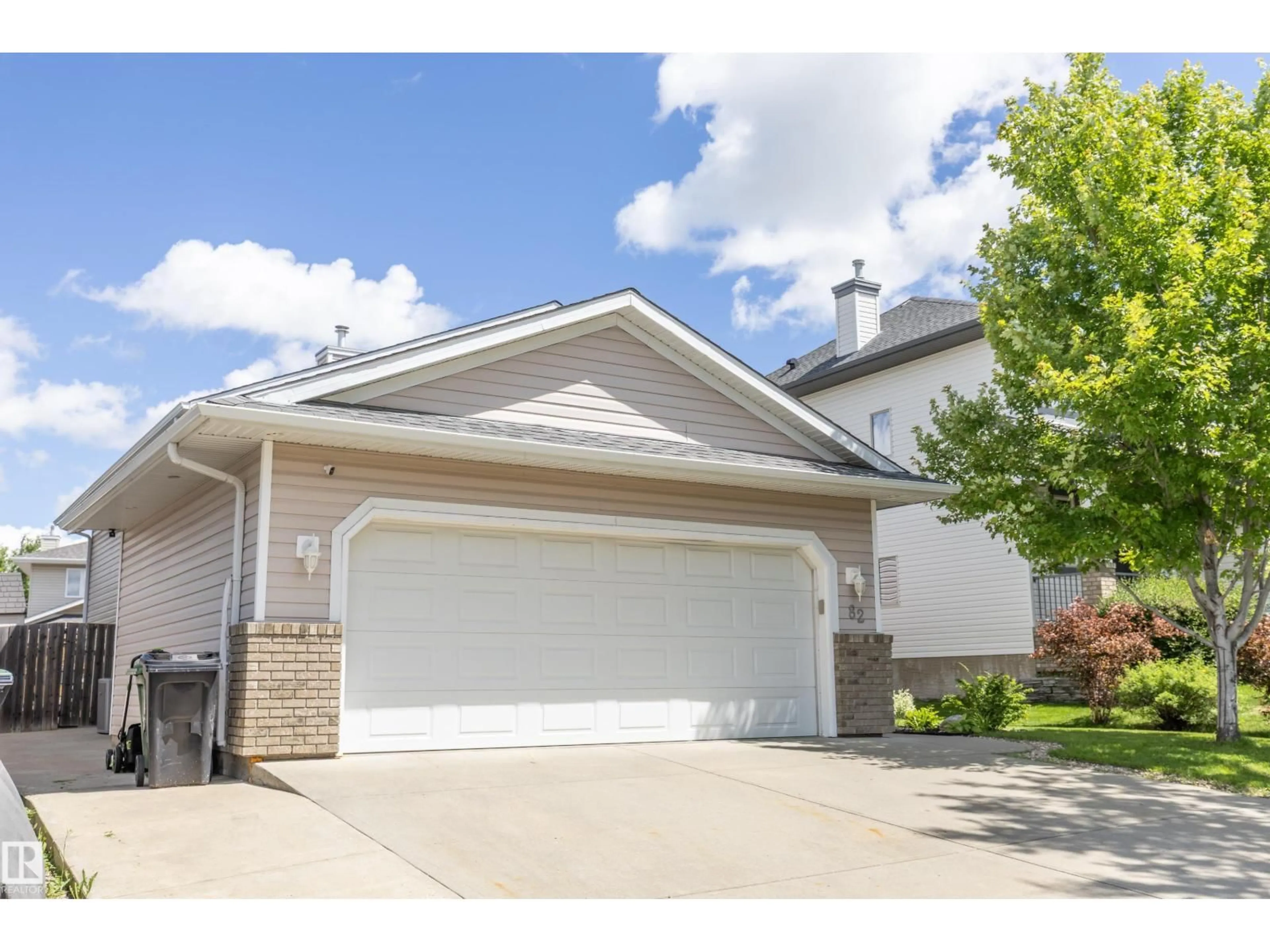 Home with vinyl exterior material, street for 82 WEDGEWOOD, Fort Saskatchewan Alberta T8L4S3