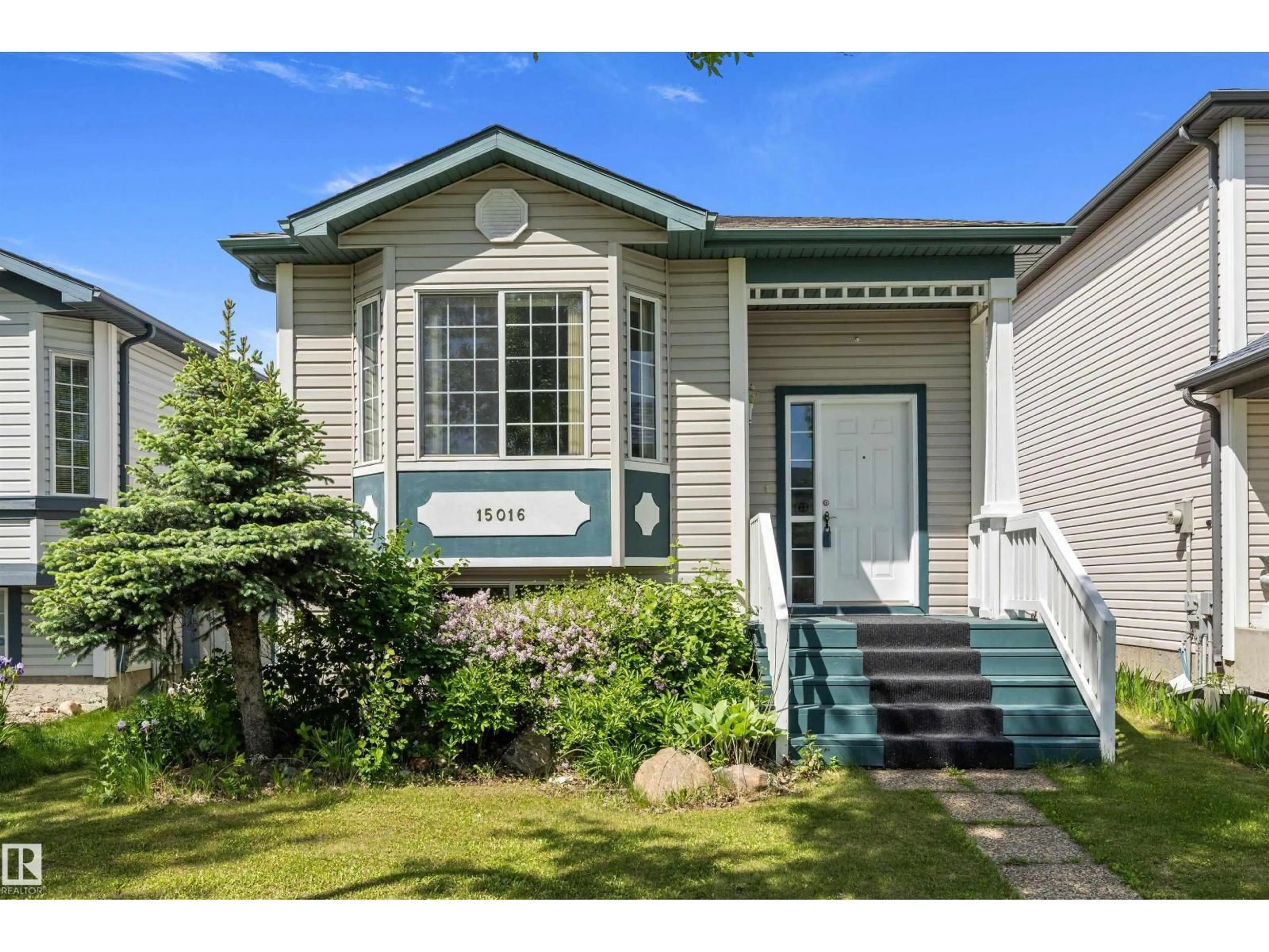 Home with vinyl exterior material, street for NW - 15016 134 ST, Edmonton Alberta T6V1M6