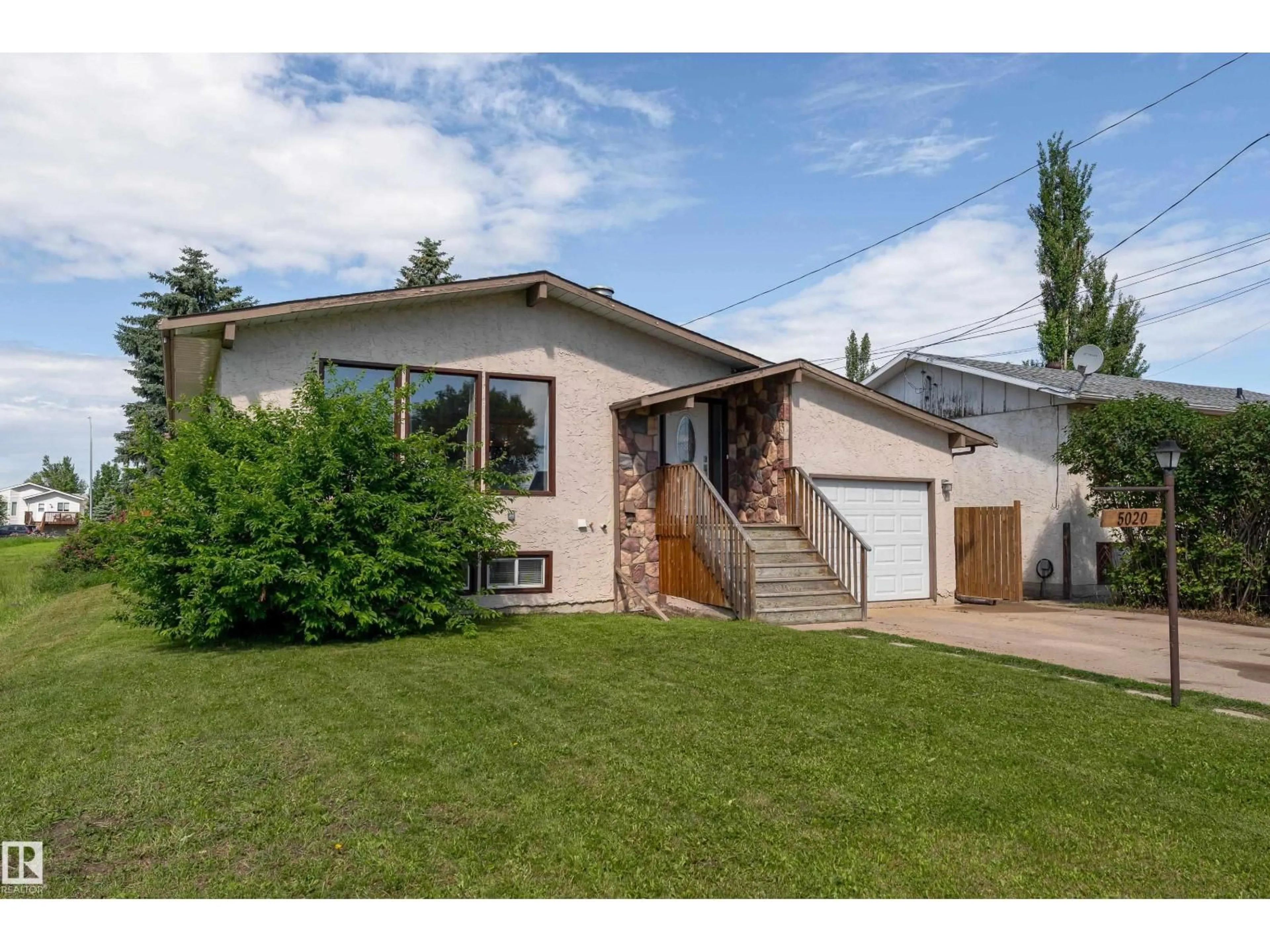 Home with vinyl exterior material, street for 5020 51 ST, Calmar Alberta T0C0V0