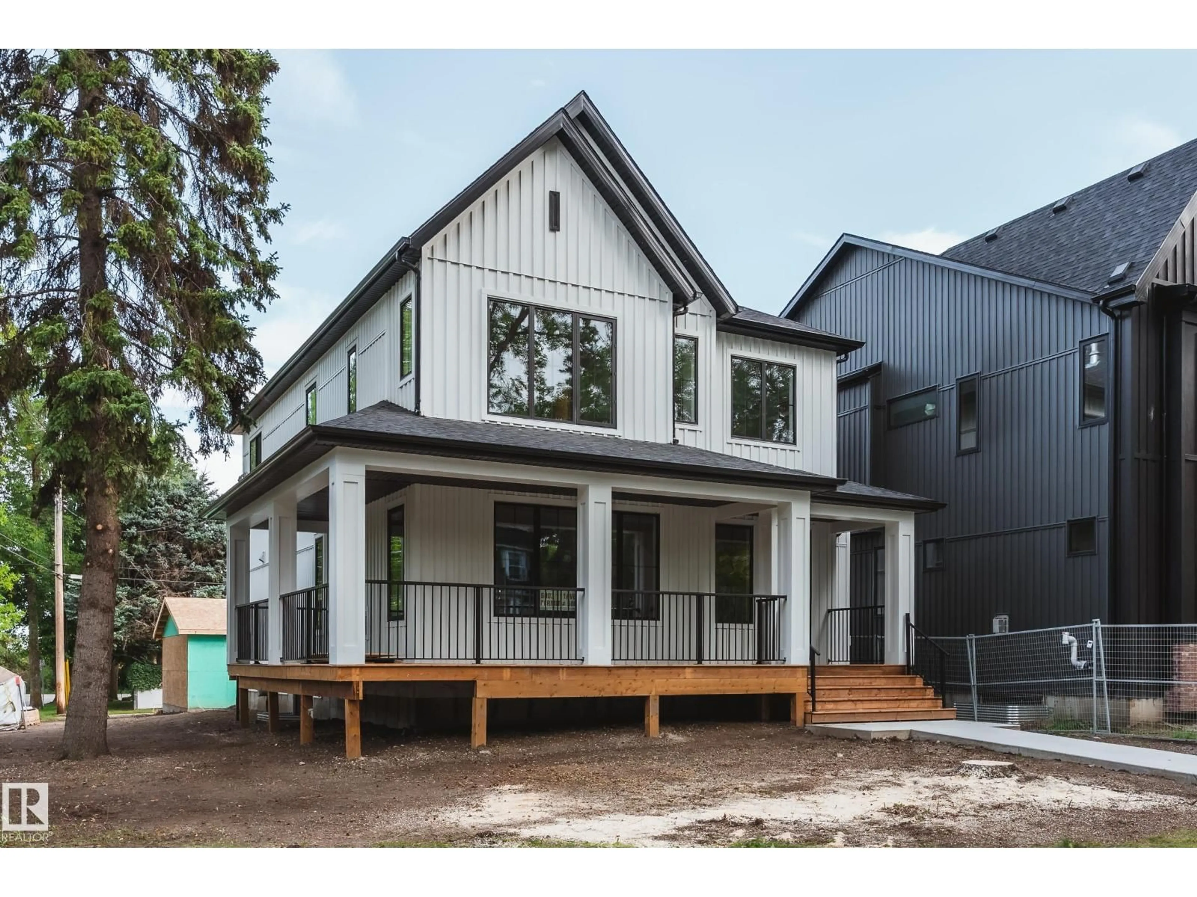 Home with vinyl exterior material, street for 6003 111 AV, Edmonton Alberta T5W0L1