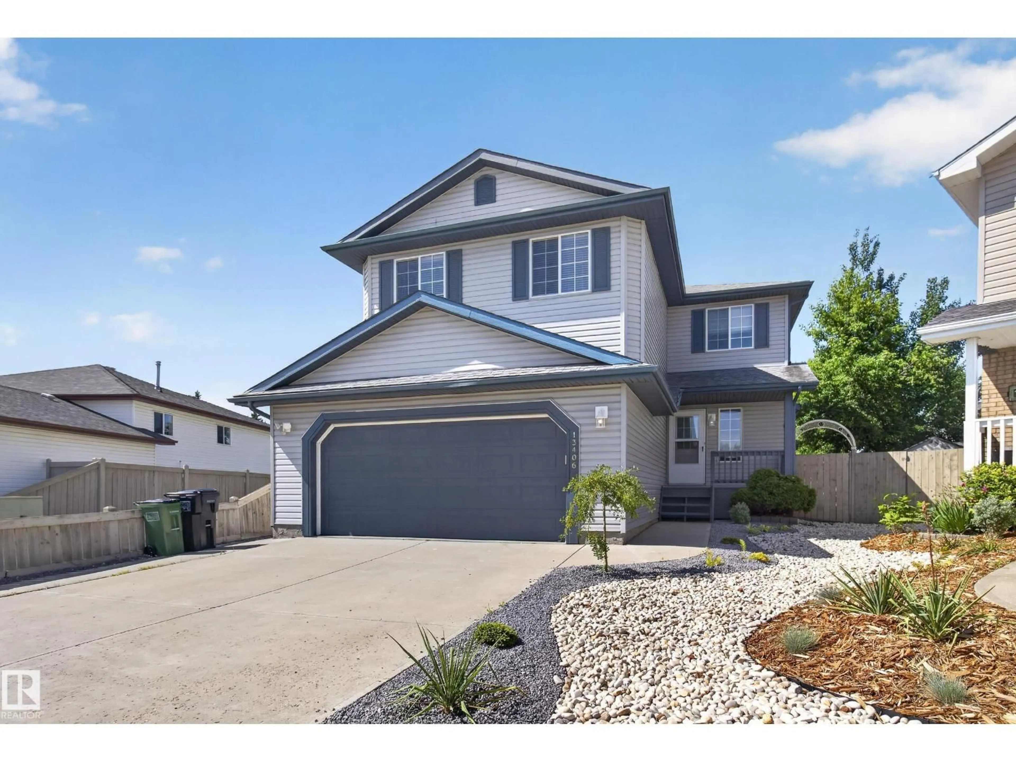 Home with vinyl exterior material, street for NW - 13406 32A ST, Edmonton Alberta T5A5E2