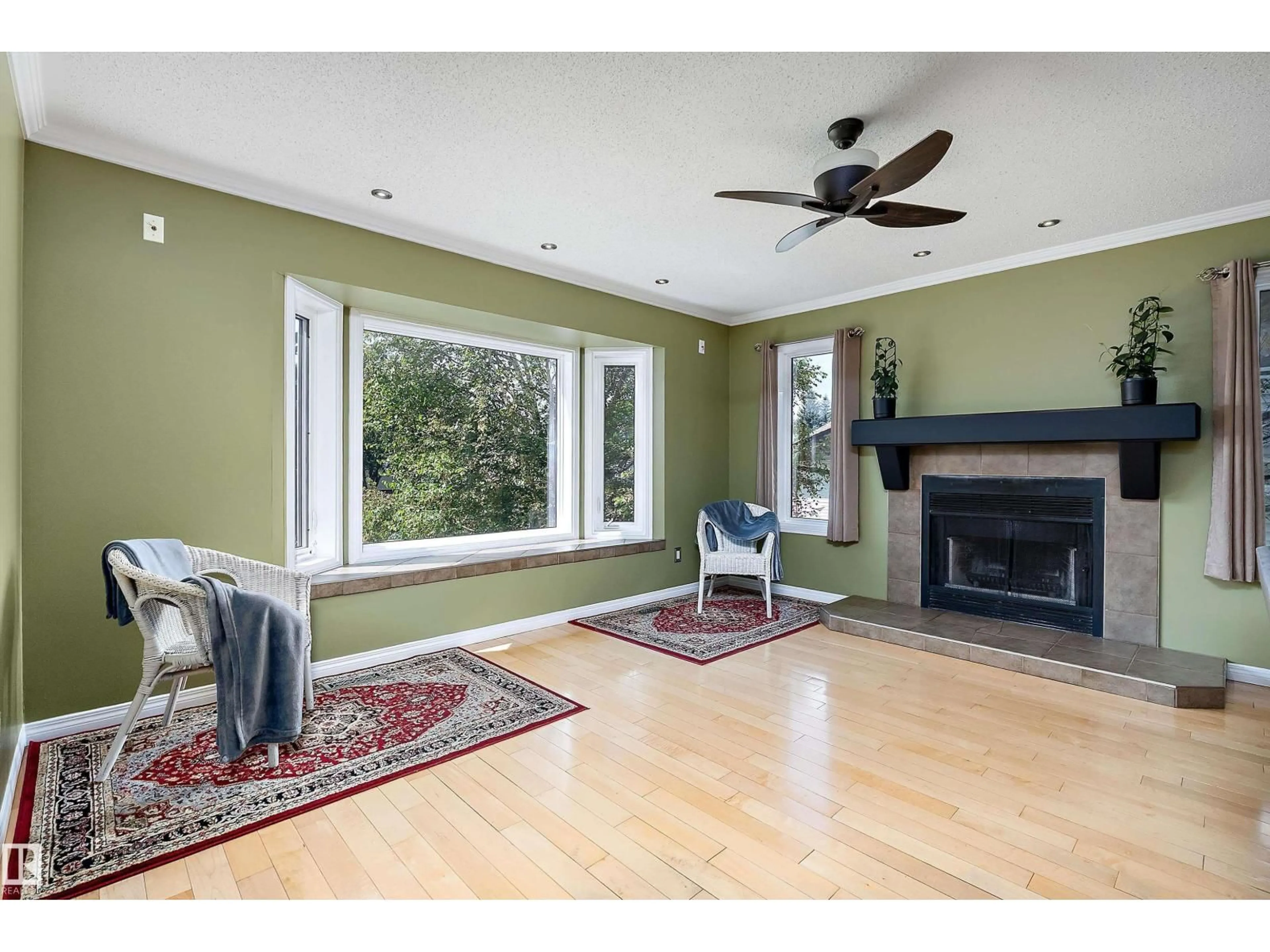 Living room with furniture, wood/laminate floor for 5609 58 ST, Beaumont Alberta T4X1A9