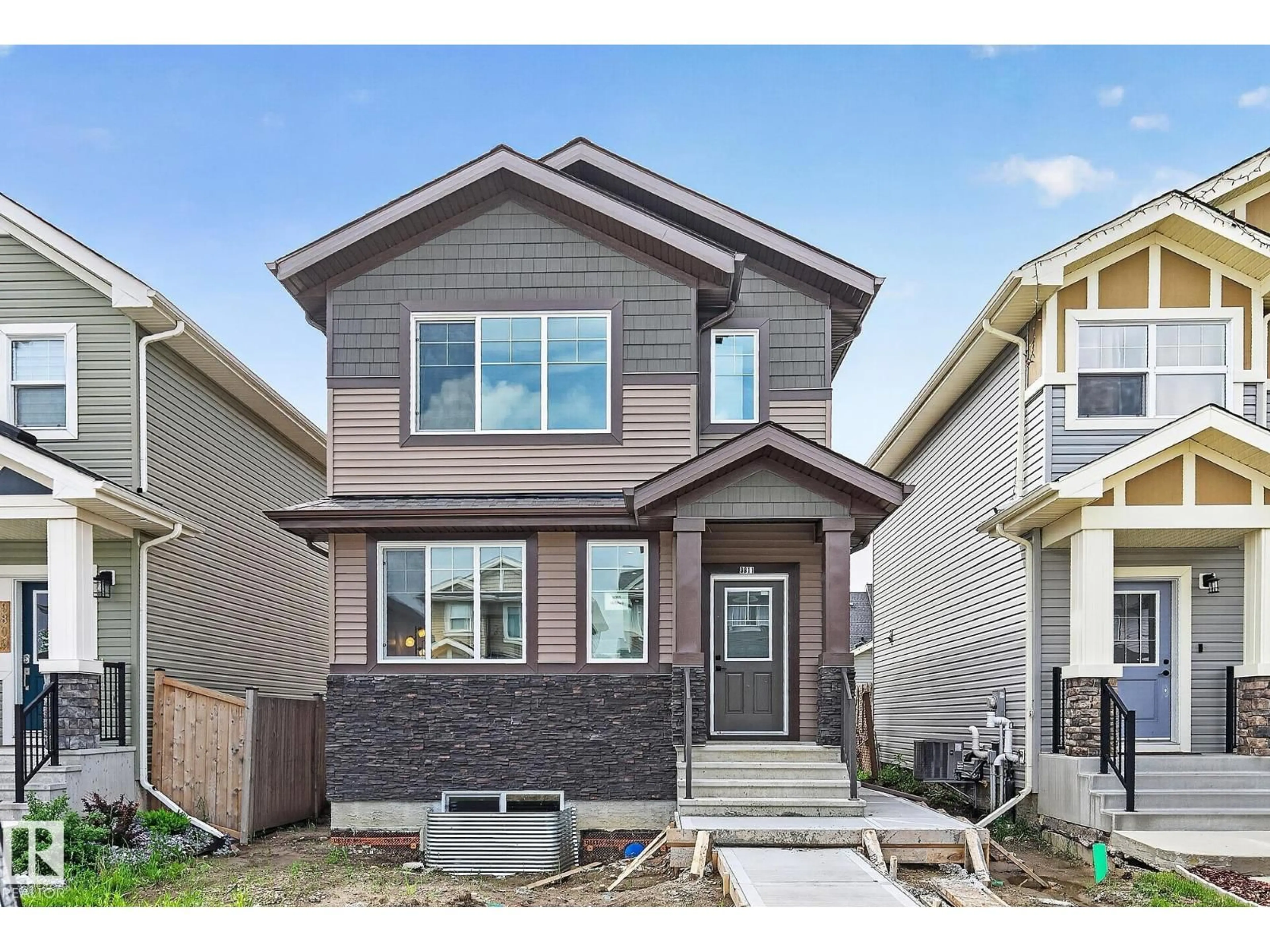 Home with vinyl exterior material, street for 9811 106 AV, Morinville Alberta T8R2P1