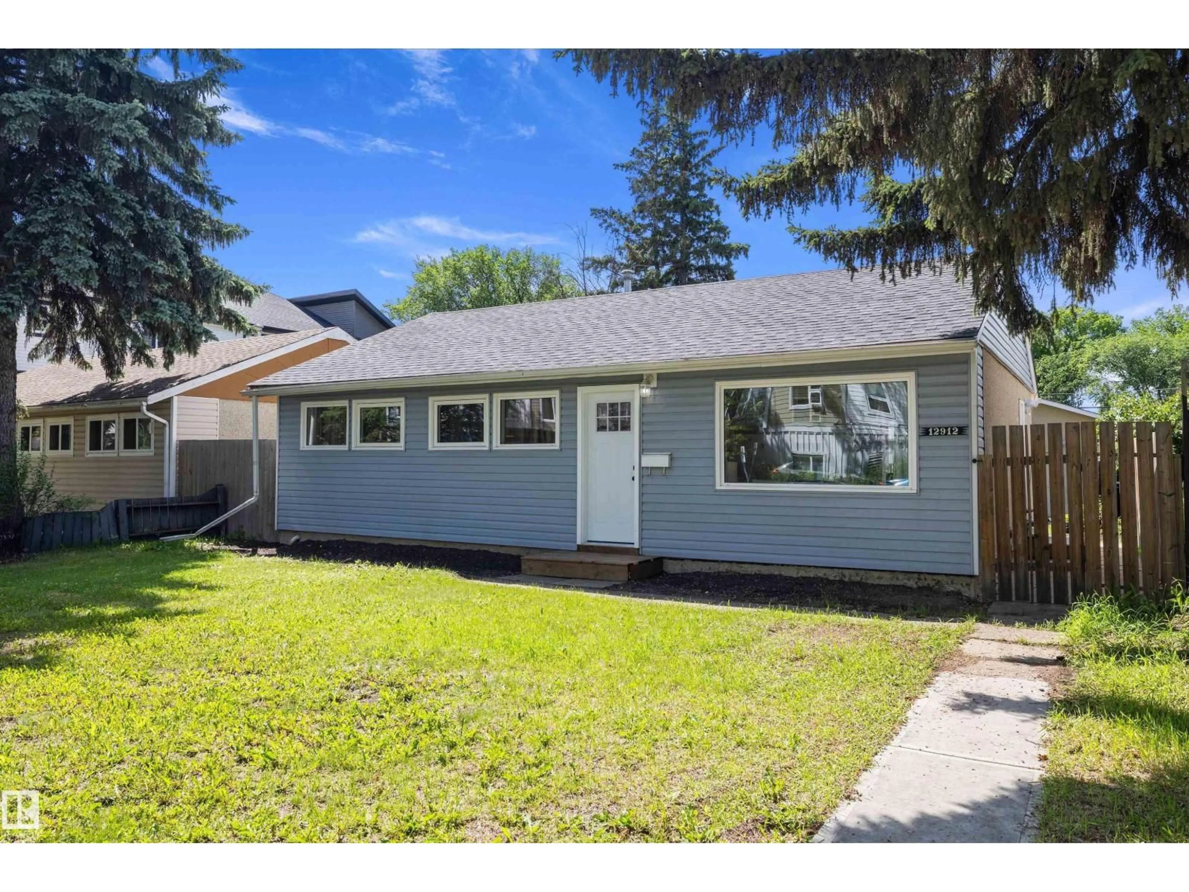 Home with vinyl exterior material, street for NW - 12912 103 ST, Edmonton Alberta T5E4M3