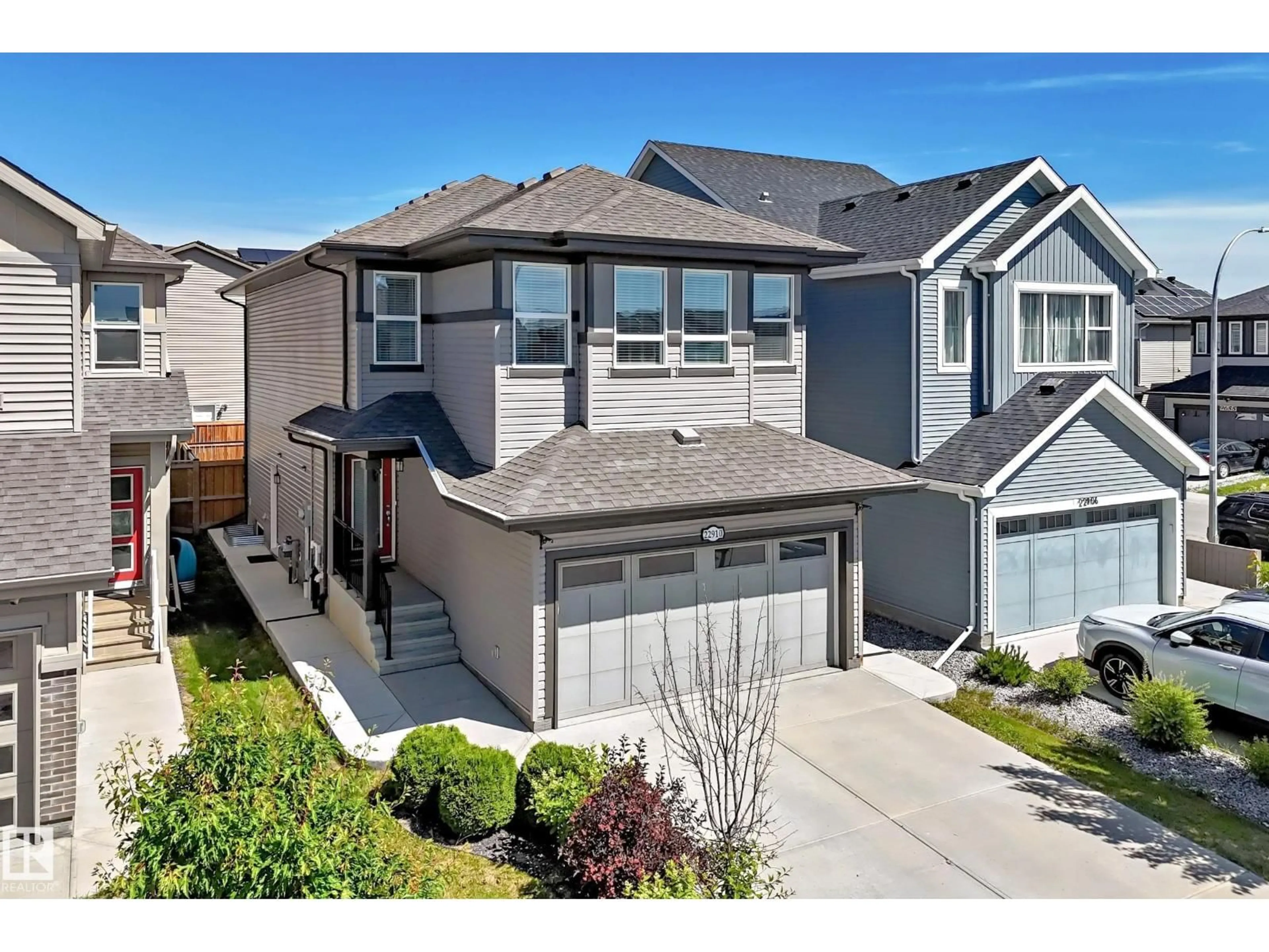 Home with vinyl exterior material, street for 22910 96A AV, Edmonton Alberta T5T7M7