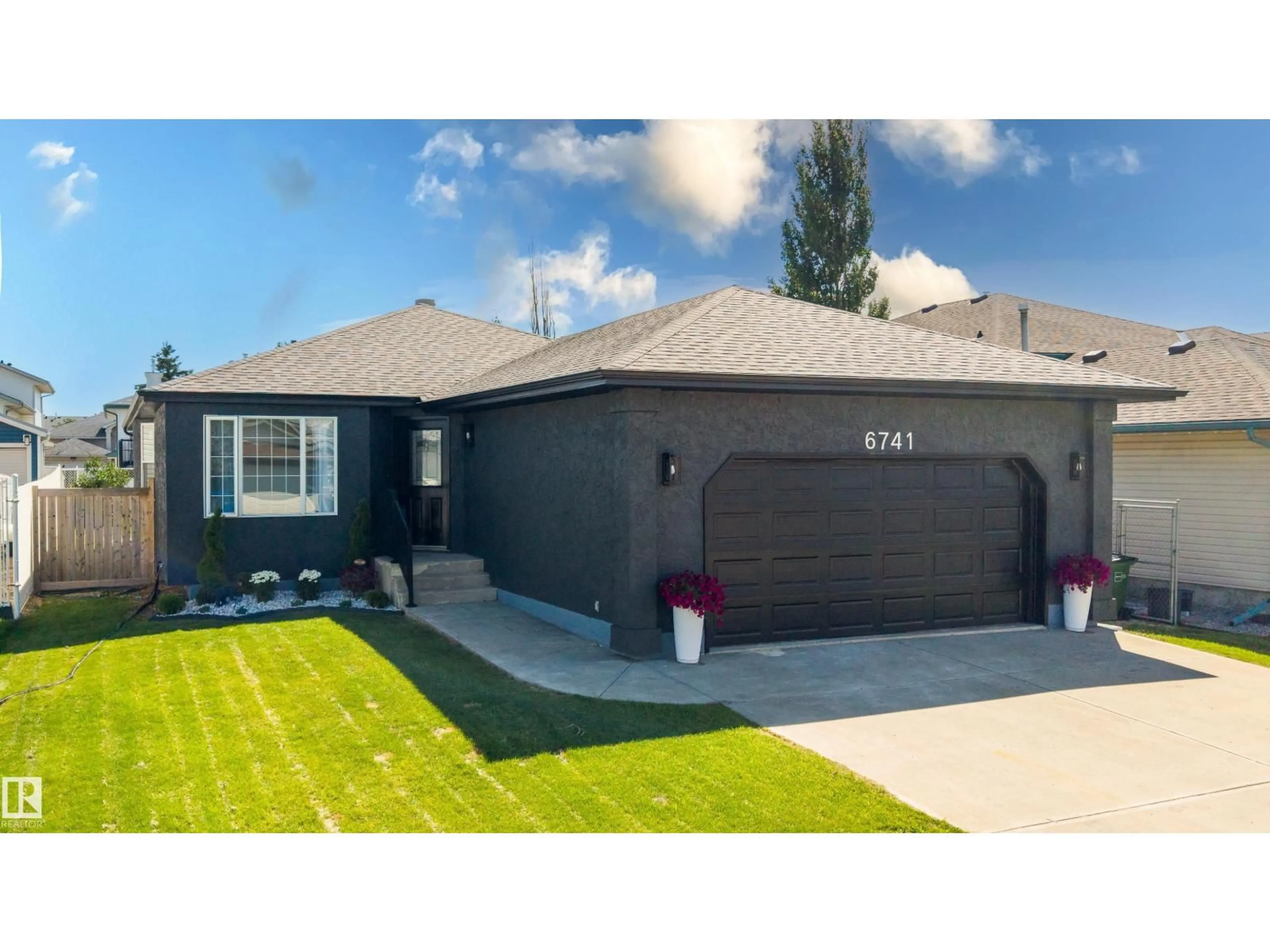 Home with vinyl exterior material, street for 6741 162A AV, Edmonton Alberta T5Z3C6