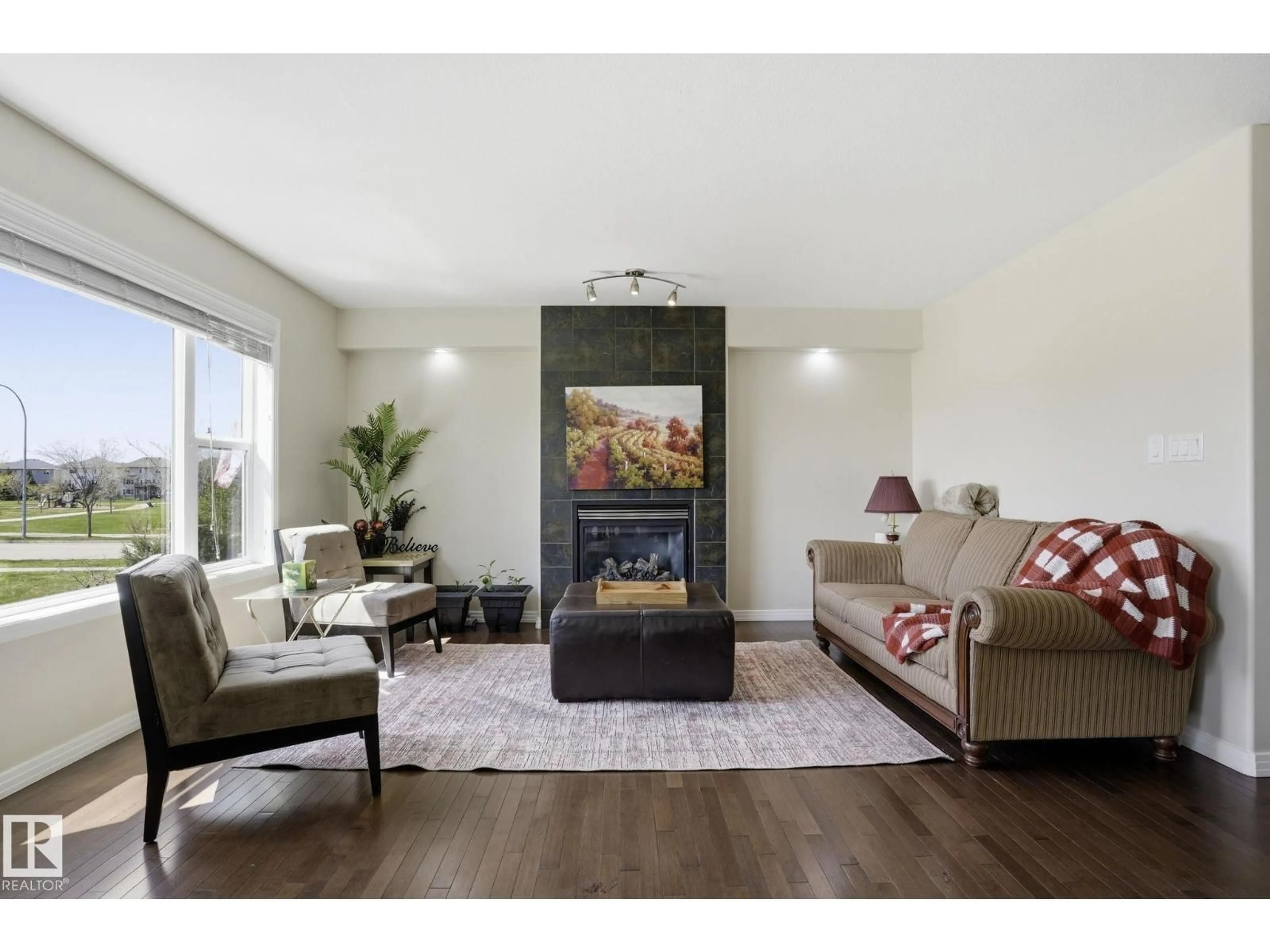 Living room with furniture, wood/laminate floor for 10 ROCKWELL CL, Fort Saskatchewan Alberta T8L0E7