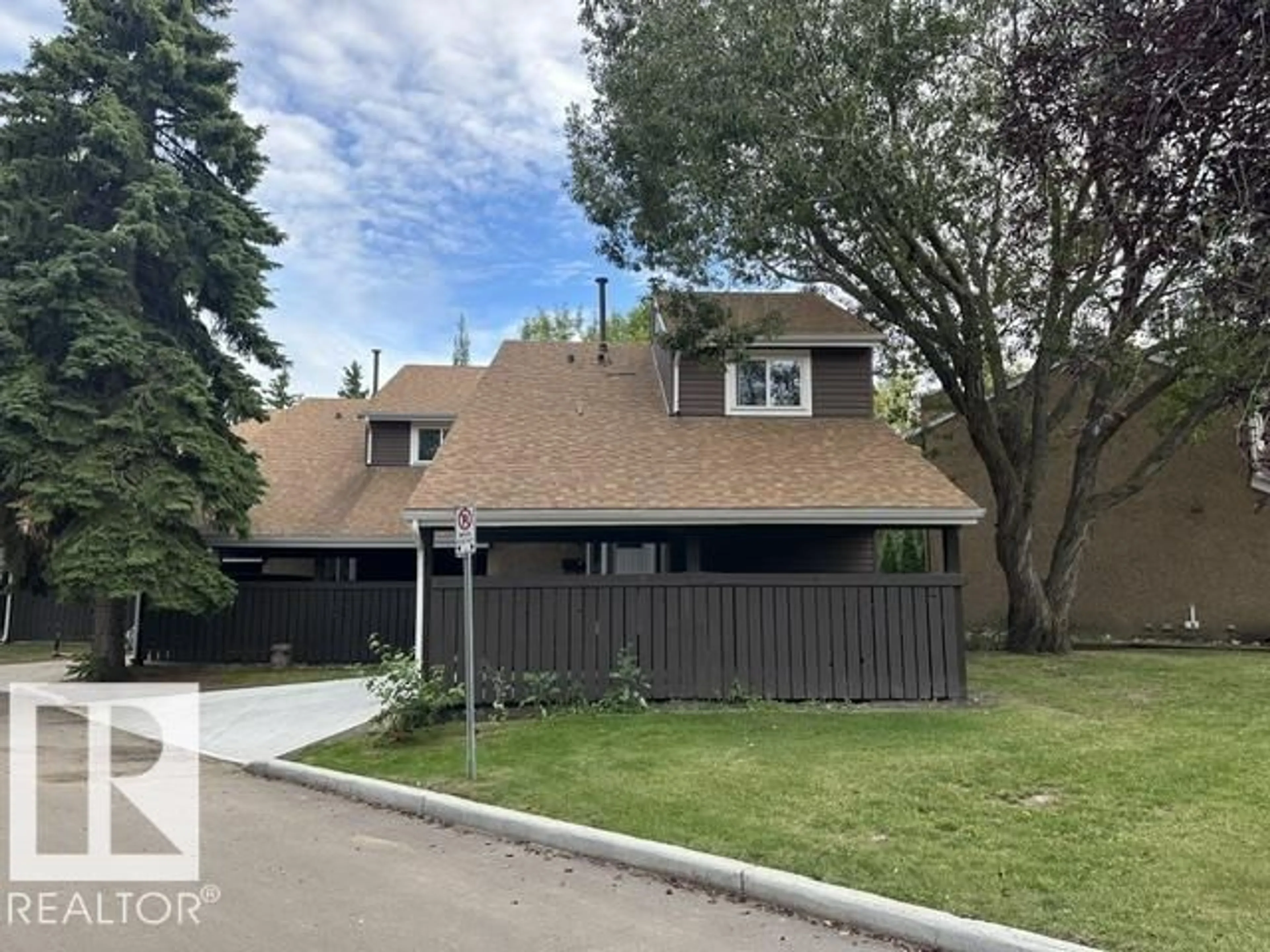 Home with vinyl exterior material, street for 18020 96 AV, Edmonton Alberta T5T3N2