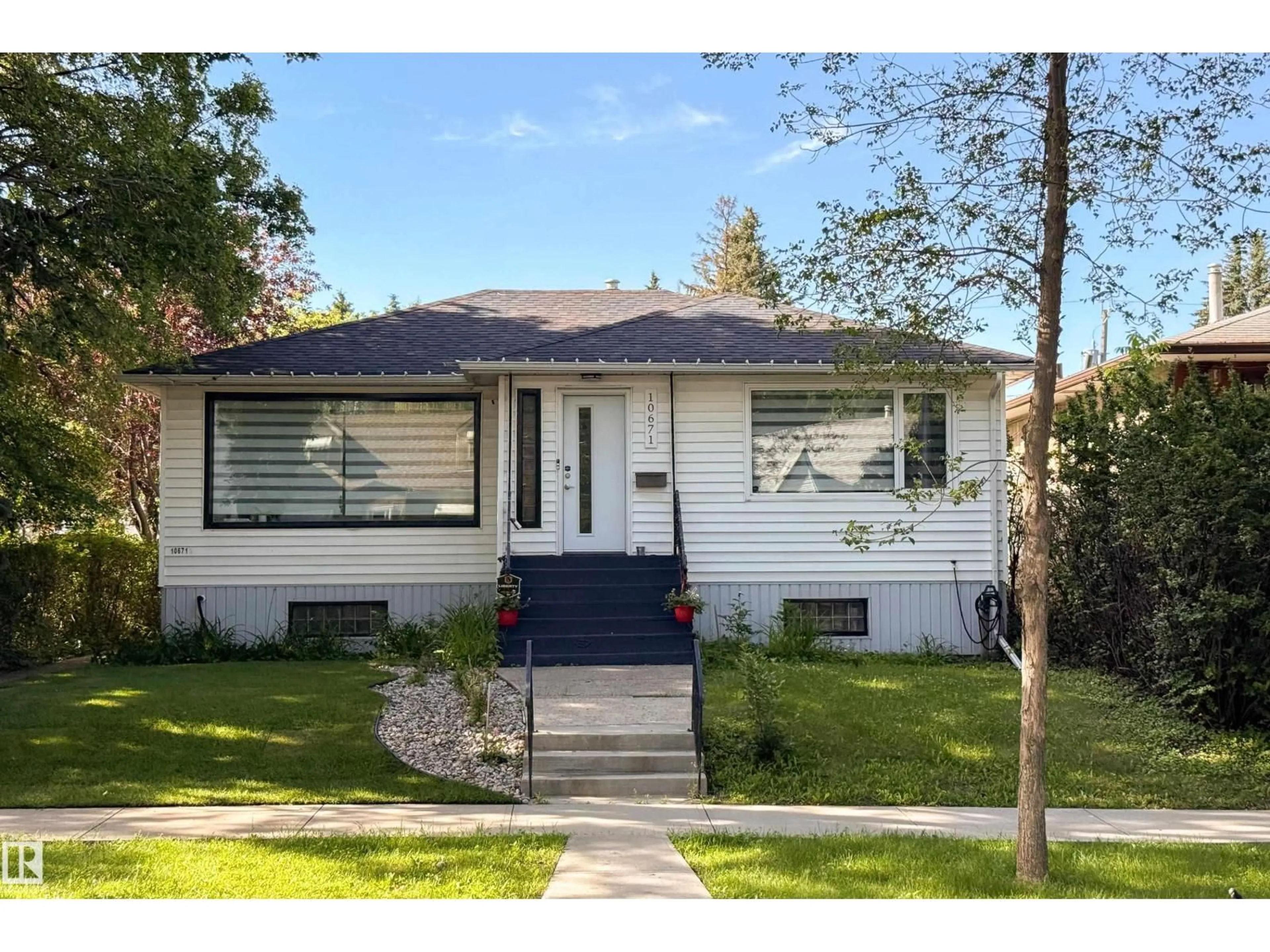 Home with vinyl exterior material, street for 10671 63 AV, Edmonton Alberta T6H1P7