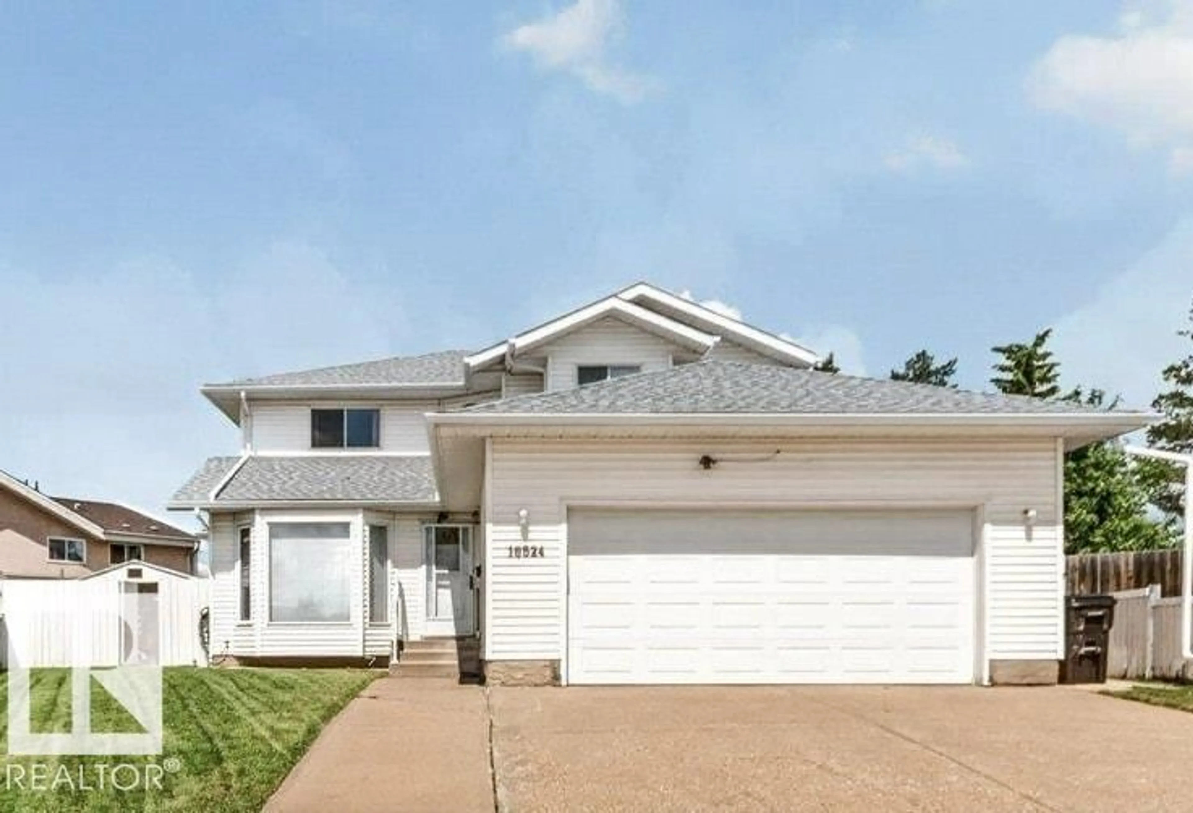 Home with vinyl exterior material, street for NW - 16524 99 ST, Edmonton Alberta T5X5L6
