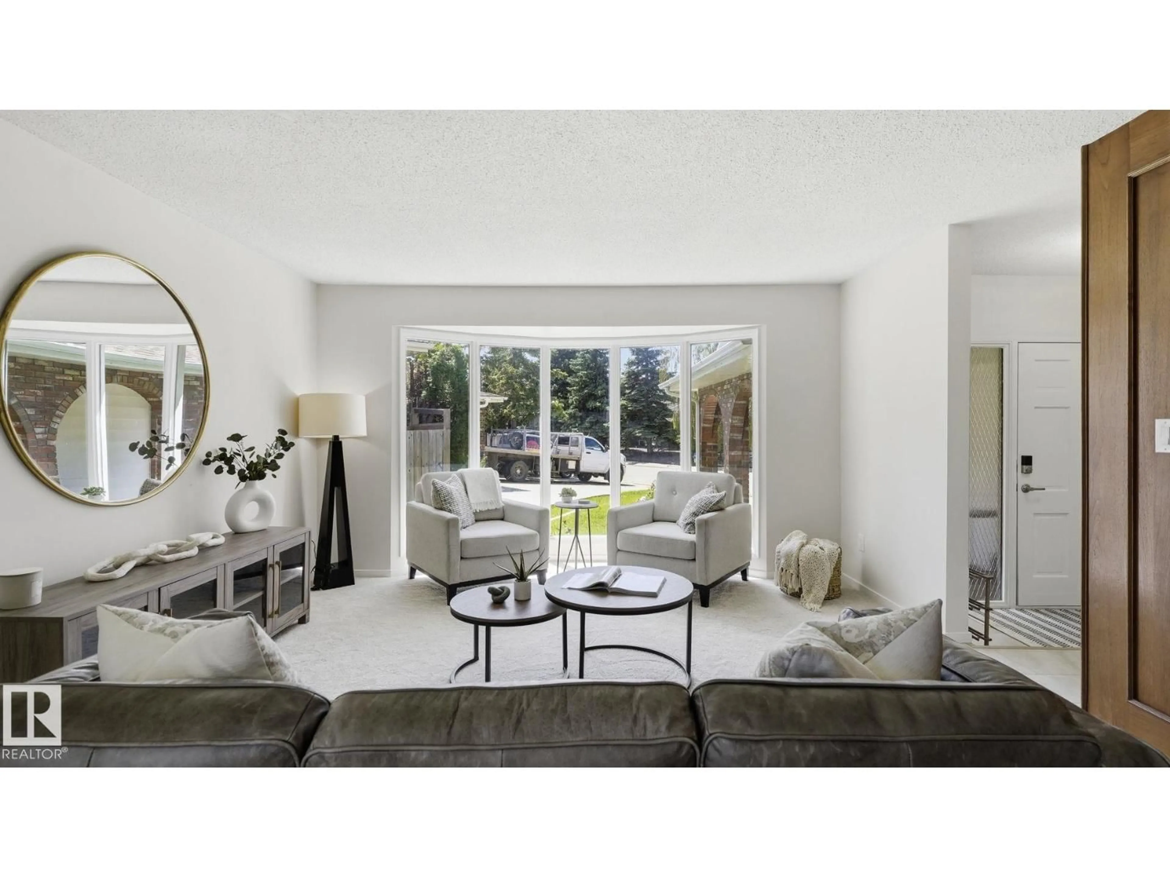 Living room with furniture, ceramic/tile floor for 2723 83 ST, Edmonton Alberta T6K3G7
