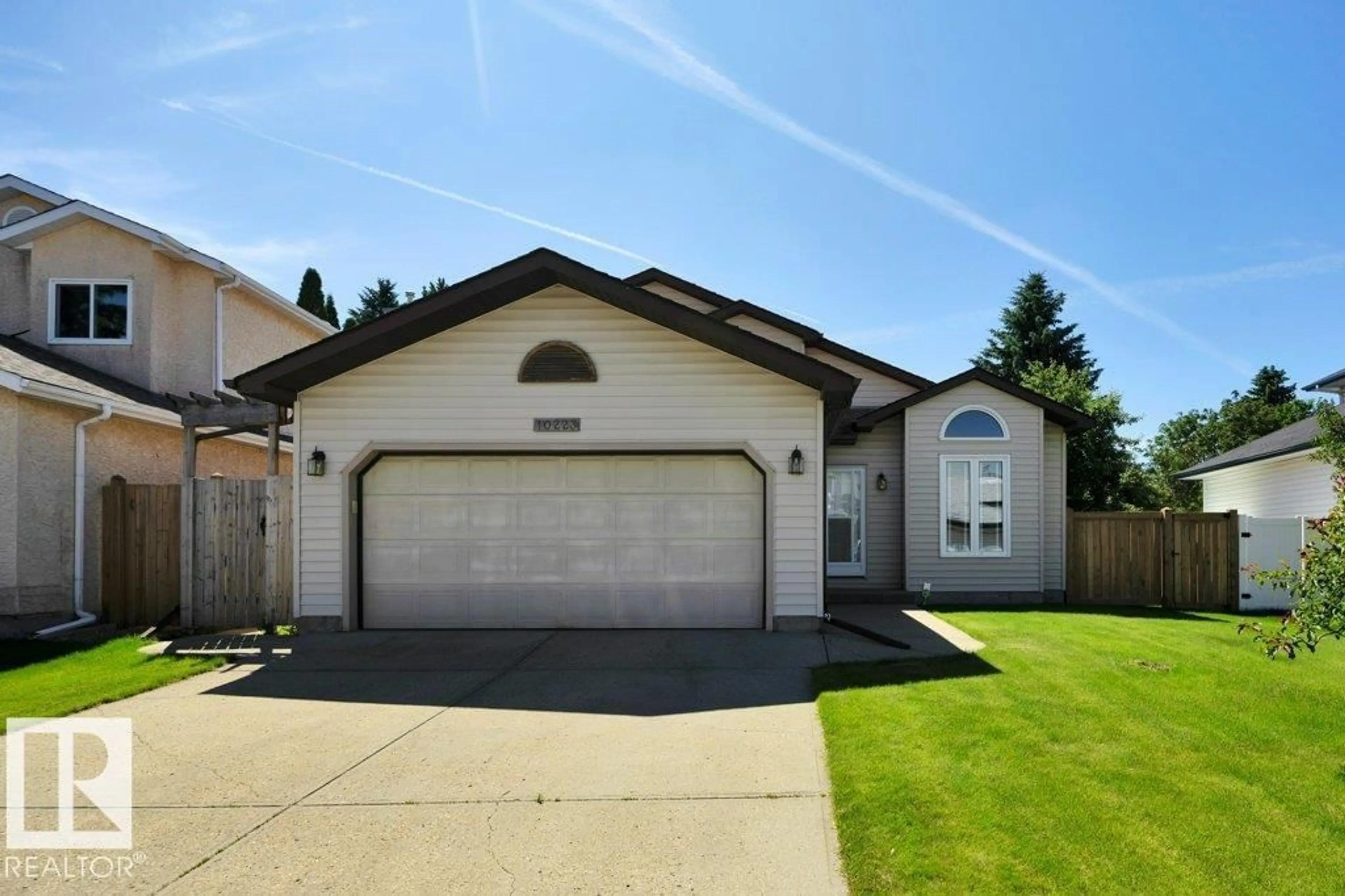 Home with vinyl exterior material, street for 10223 174 AV, Edmonton Alberta T5X5W5