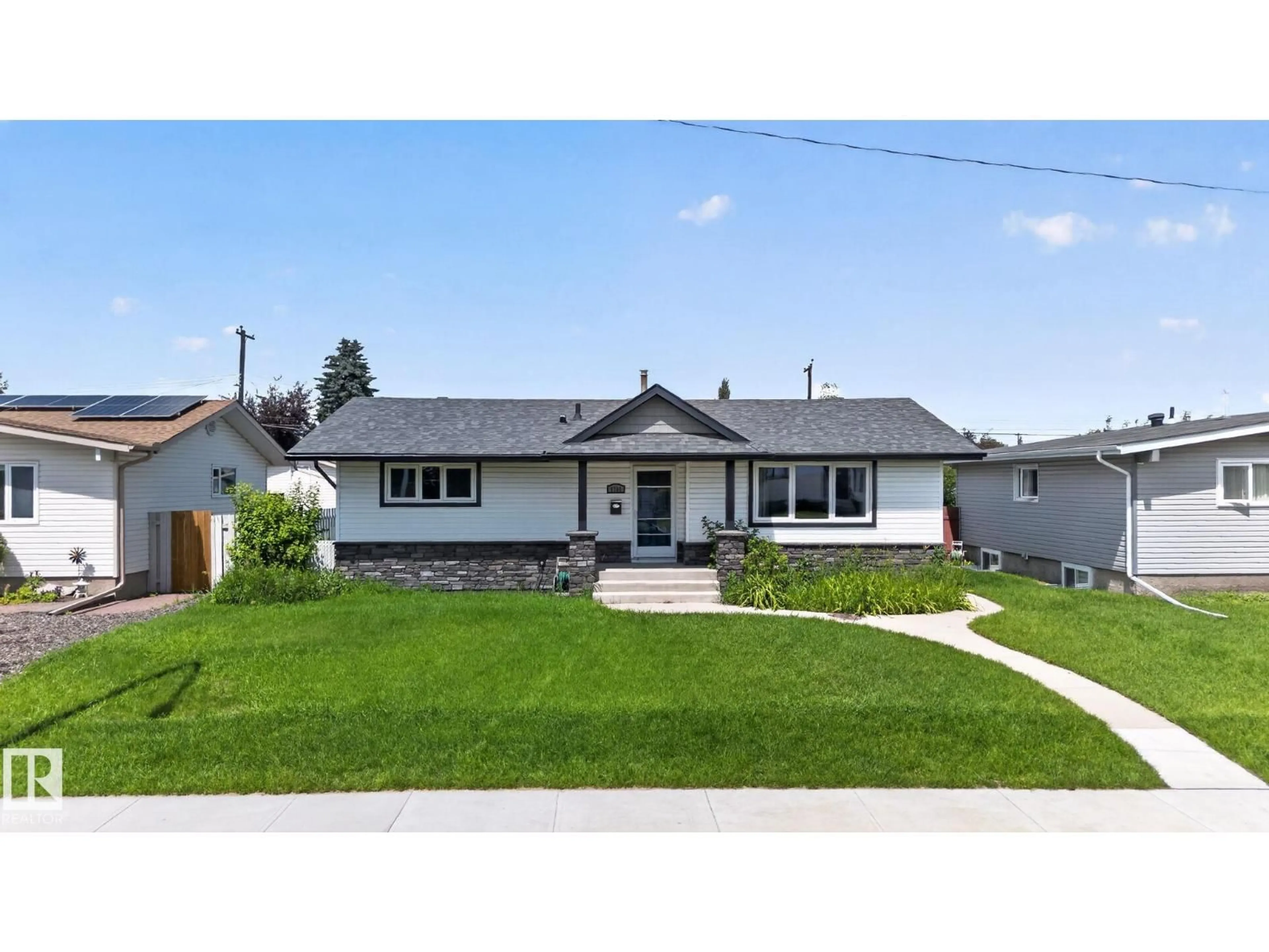 Home with vinyl exterior material, street for 6704 94A AV, Edmonton Alberta T6B0Y8