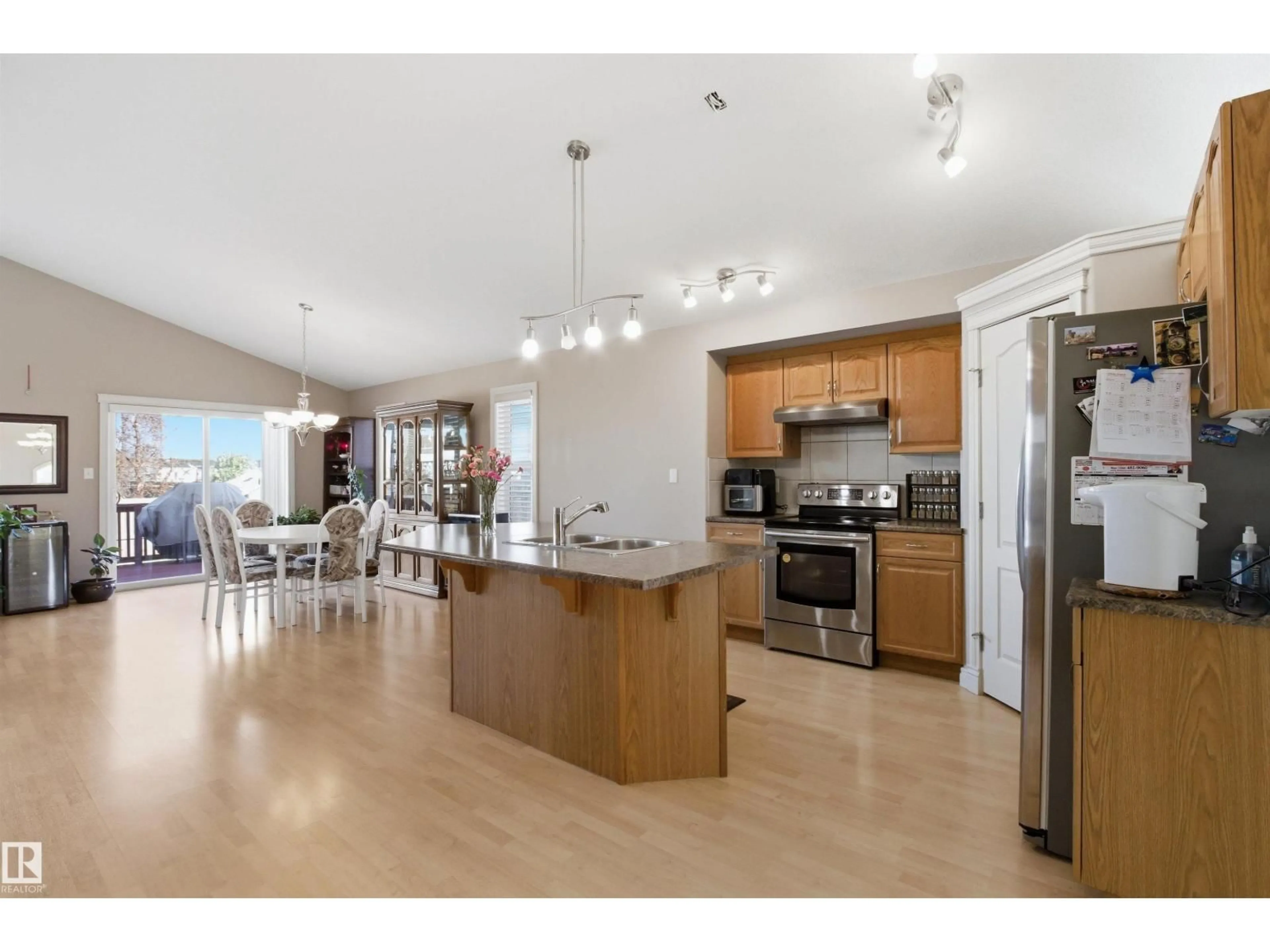 Open concept kitchen, wood/laminate floor for NW - 16204 48 ST, Edmonton Alberta T5A2J7
