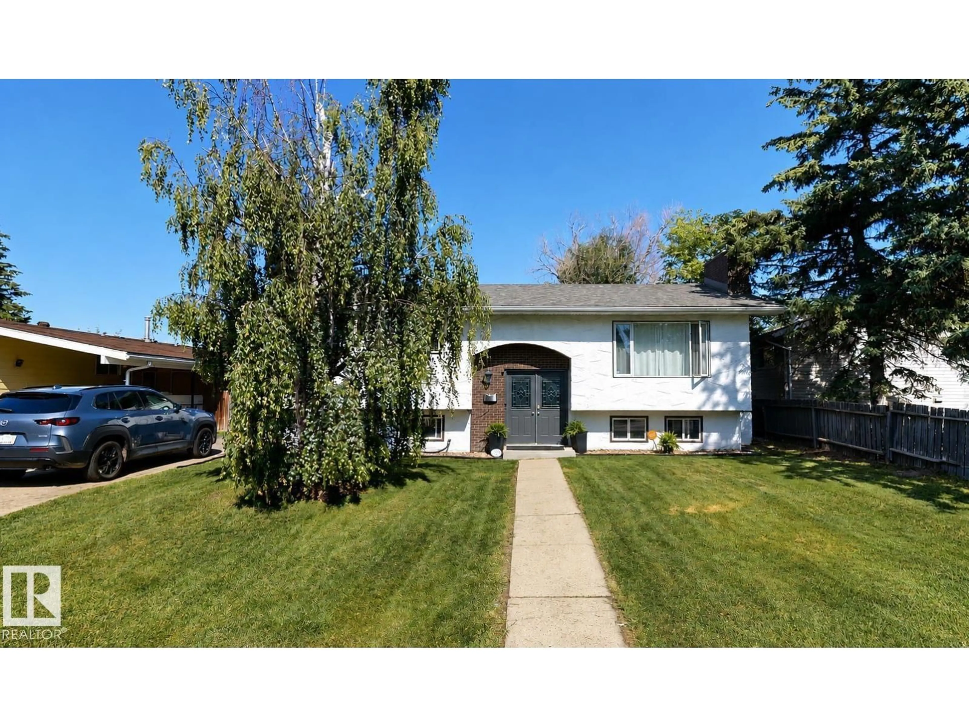 Home with vinyl exterior material, street for 1112 87 ST, Edmonton Alberta T6K1Y1