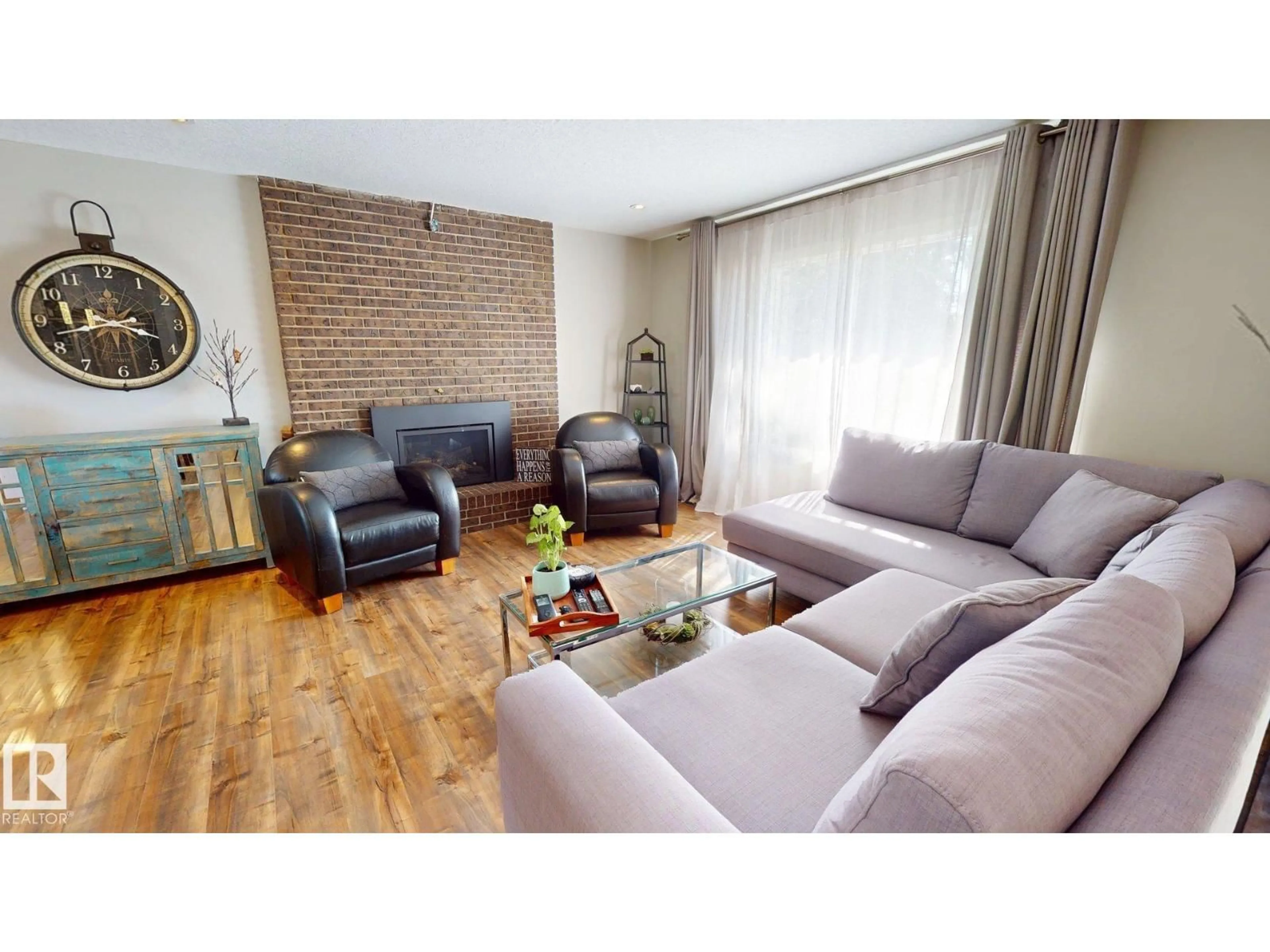 Living room with furniture, wood/laminate floor for 1112 87 ST, Edmonton Alberta T6K1Y1