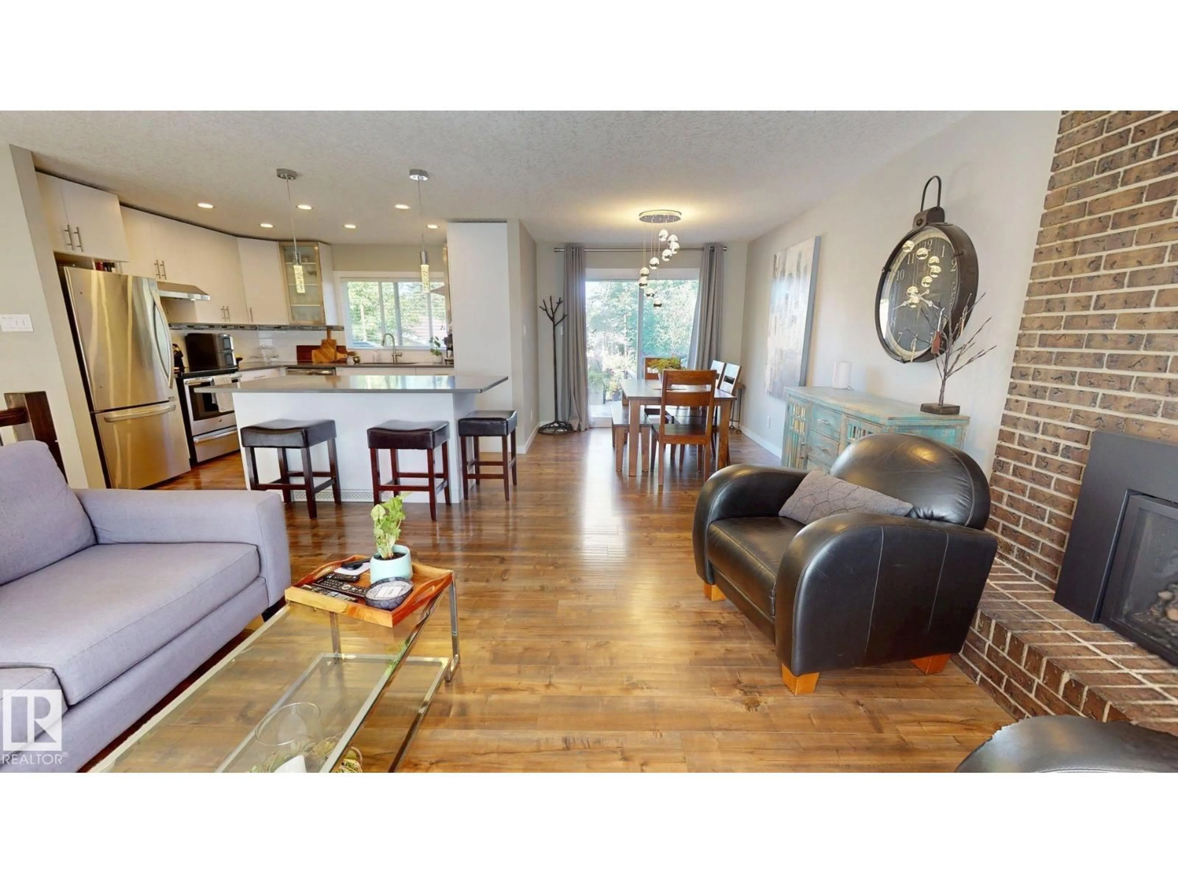 Open concept kitchen, wood/laminate floor for 1112 87 ST, Edmonton Alberta T6K1Y1