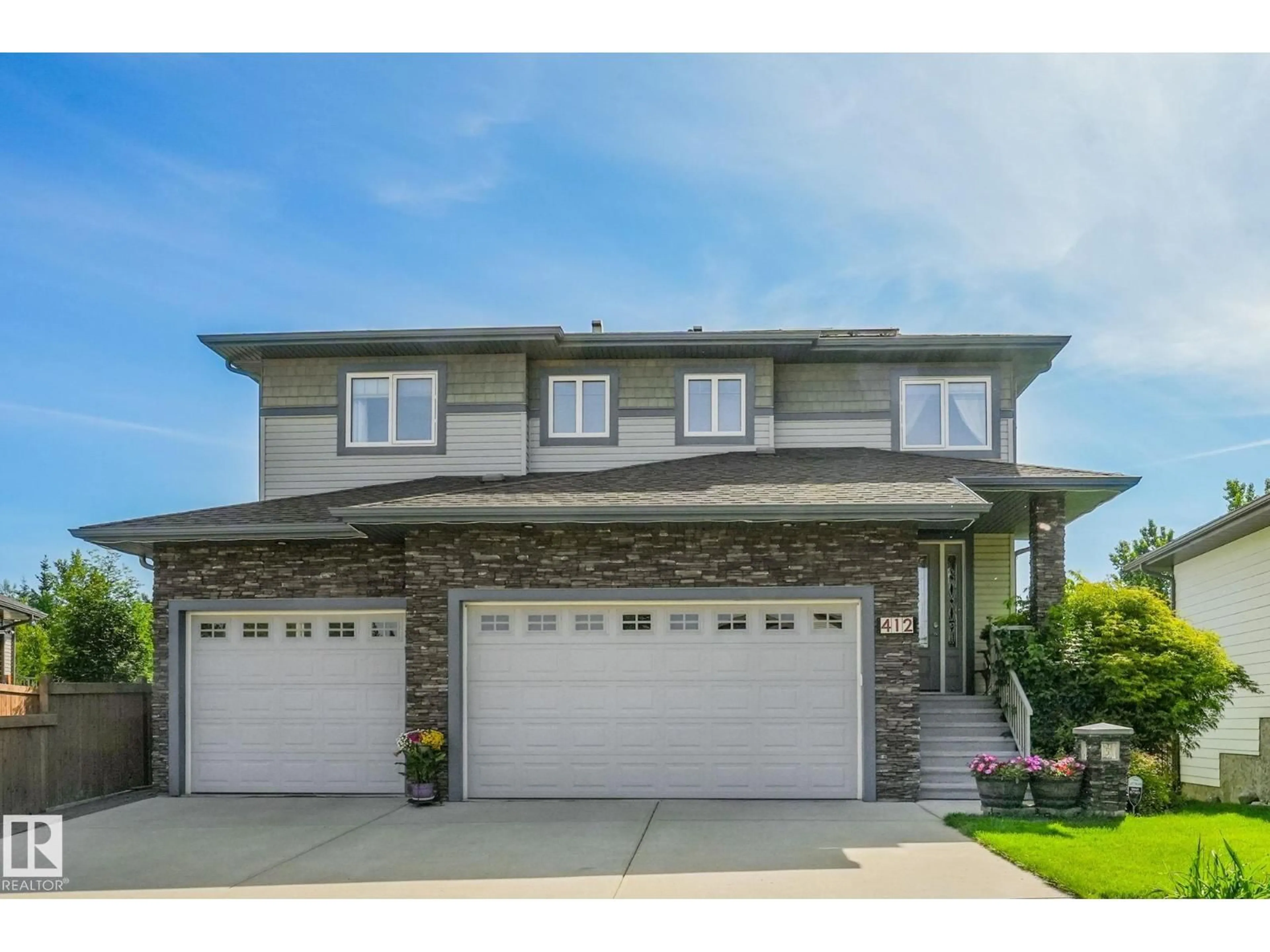 Home with vinyl exterior material, street for 412 RAVINE CO, Devon Alberta T9G0A2