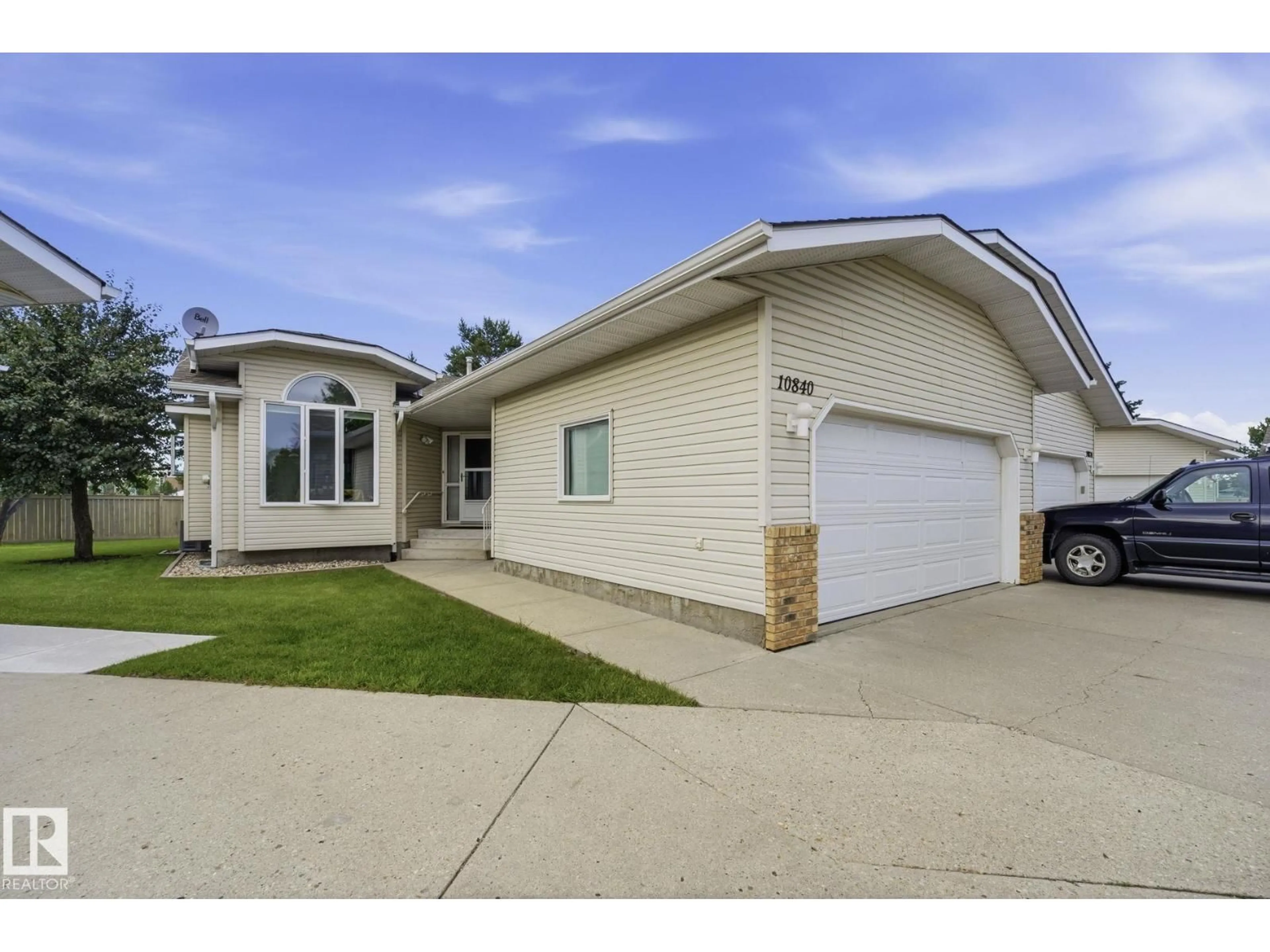Home with vinyl exterior material, street for NW - 10840 25 AV, Edmonton Alberta T5J6N5