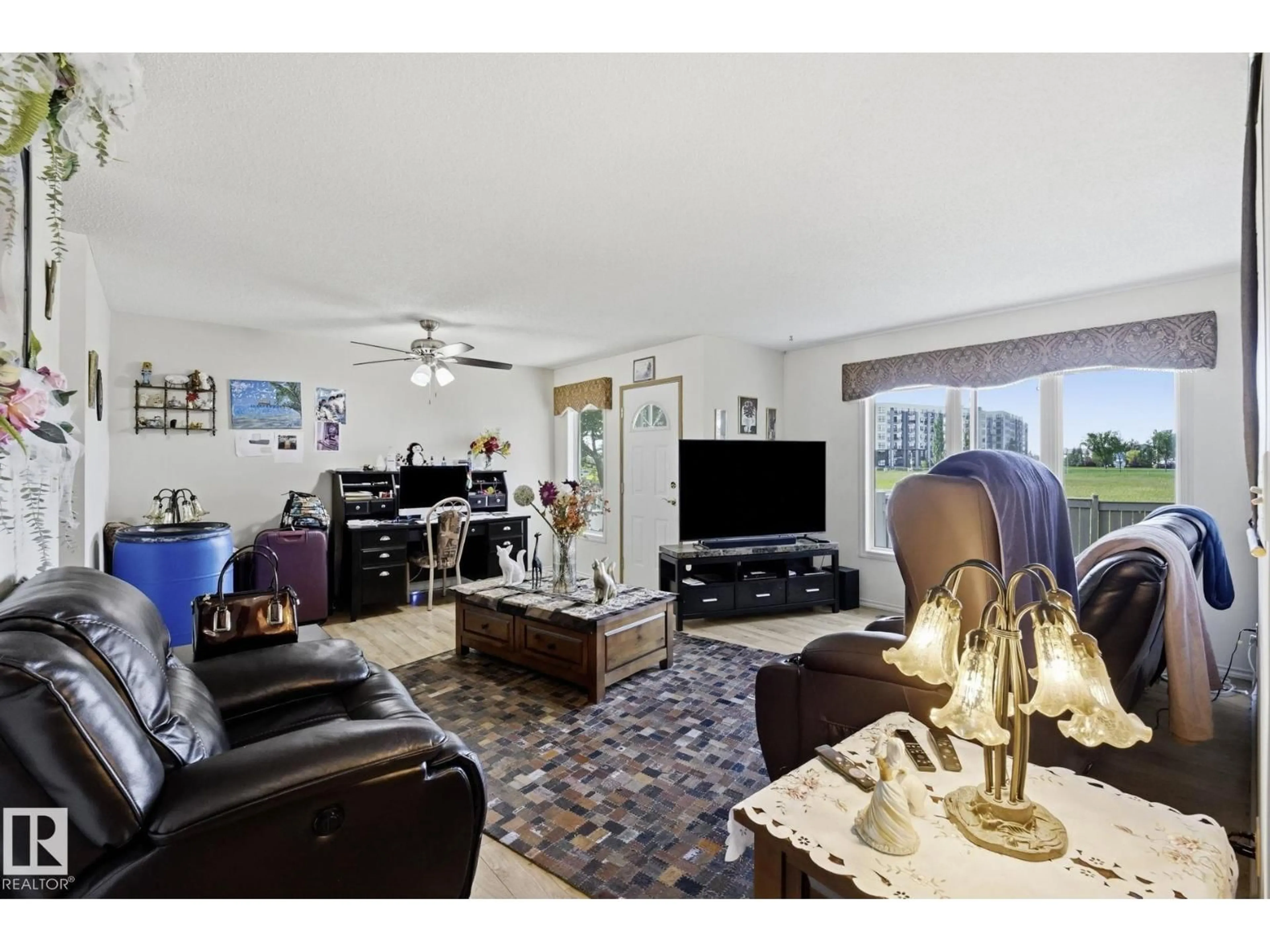 Living room with furniture, unknown for NW - 10840 25 AV, Edmonton Alberta T5J6N5