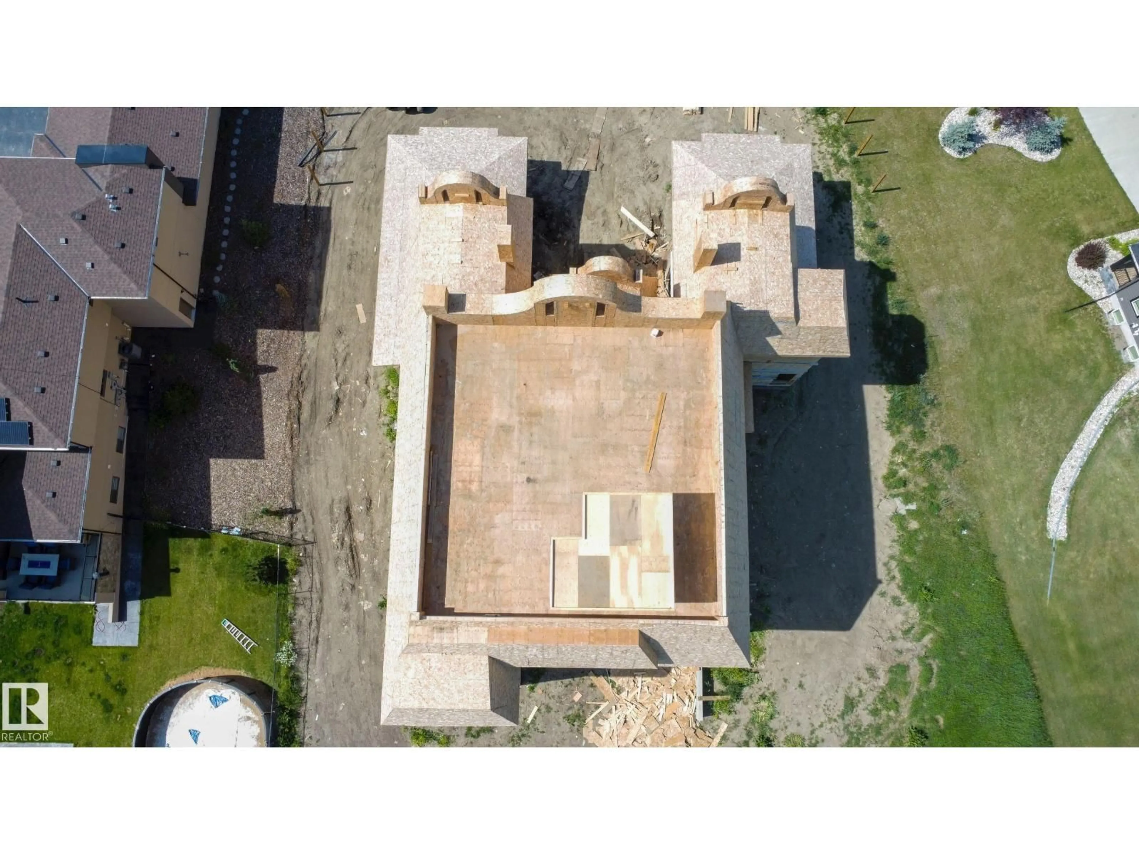A pic from outside/outdoor area/front of a property/back of a property/a pic from drone, building for 9 - 26409 TWP ROAD 532 A, Rural Parkland County Alberta T7X3H5