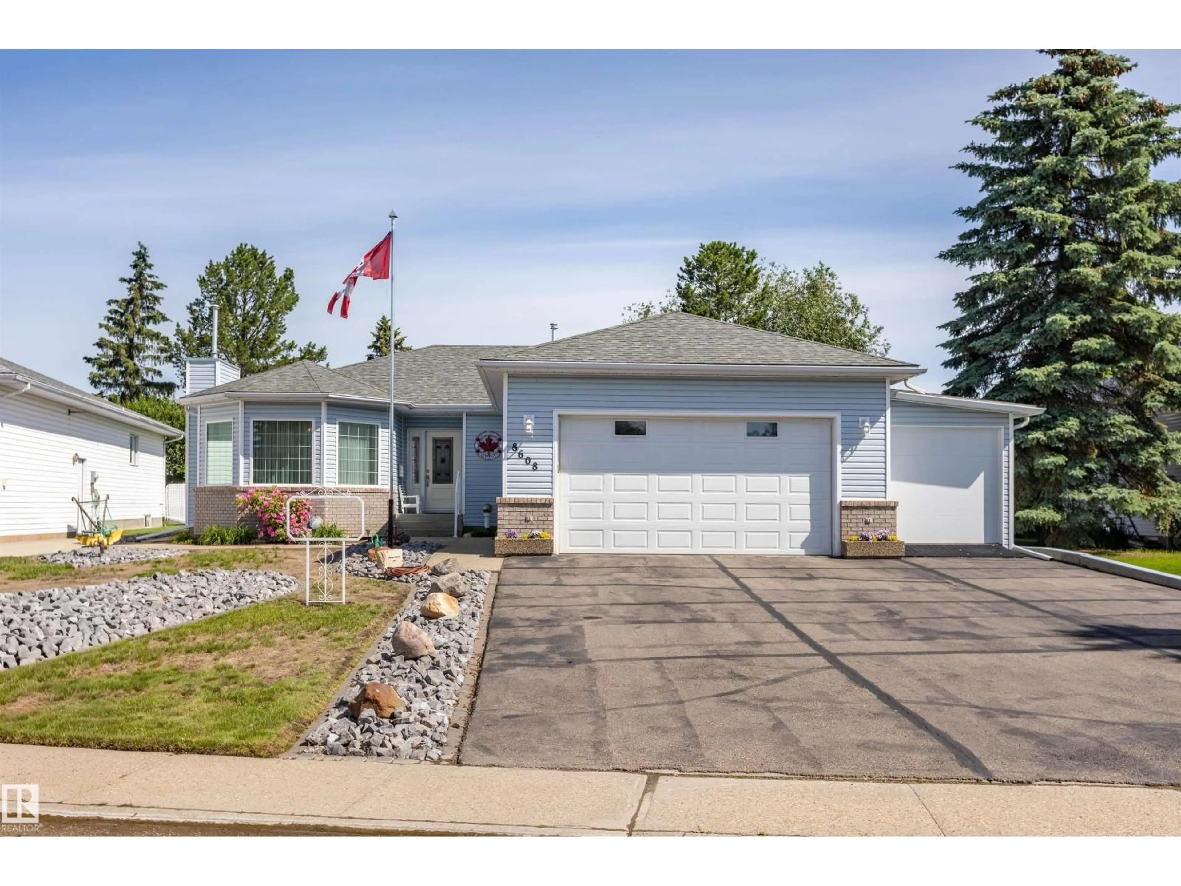 Home with vinyl exterior material, street for 8608 107 AV, Morinville Alberta T8R1C2