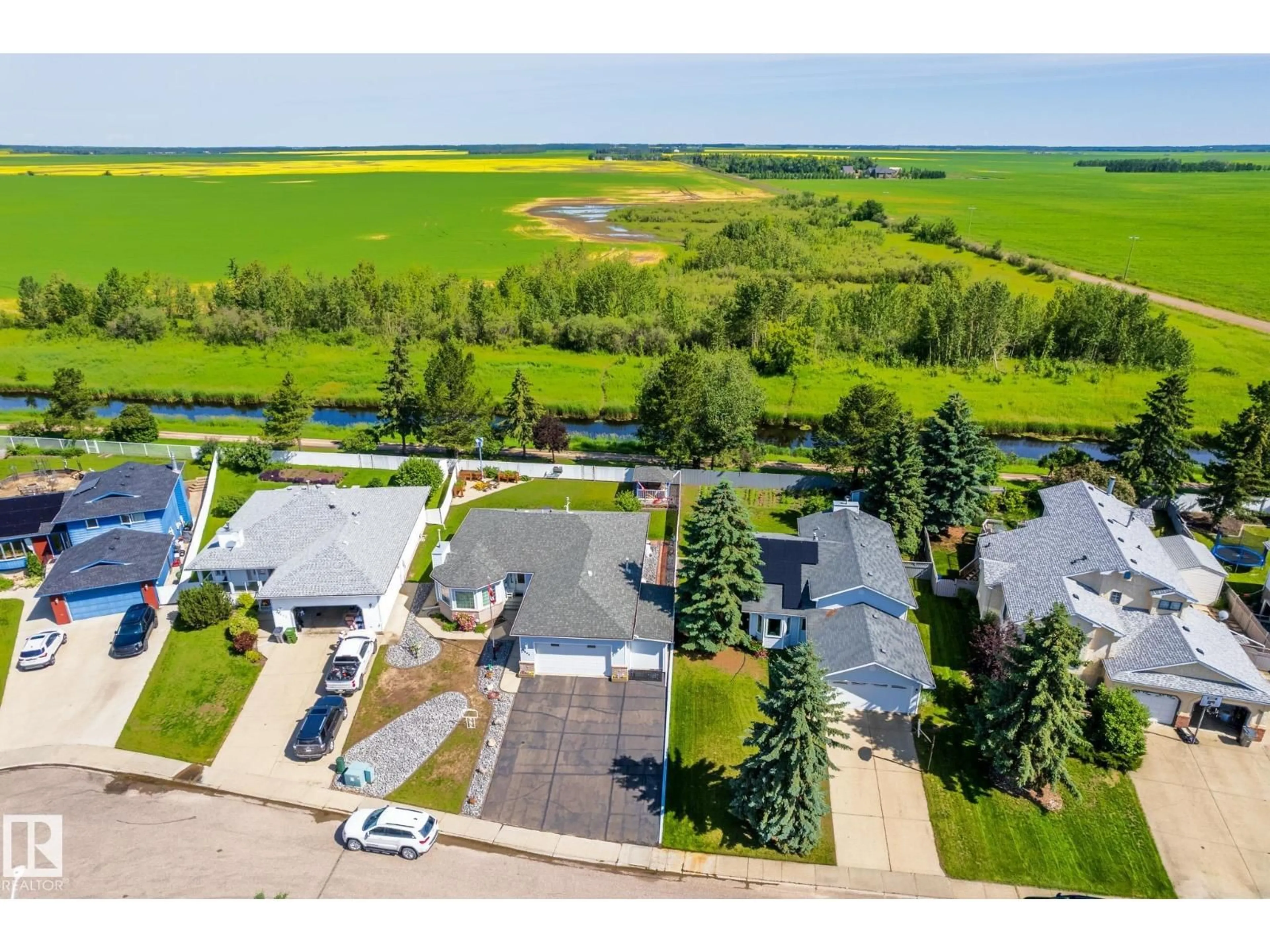 A pic from outside/outdoor area/front of a property/back of a property/a pic from drone, water/lake/river/ocean view for 8608 107 AV, Morinville Alberta T8R1C2