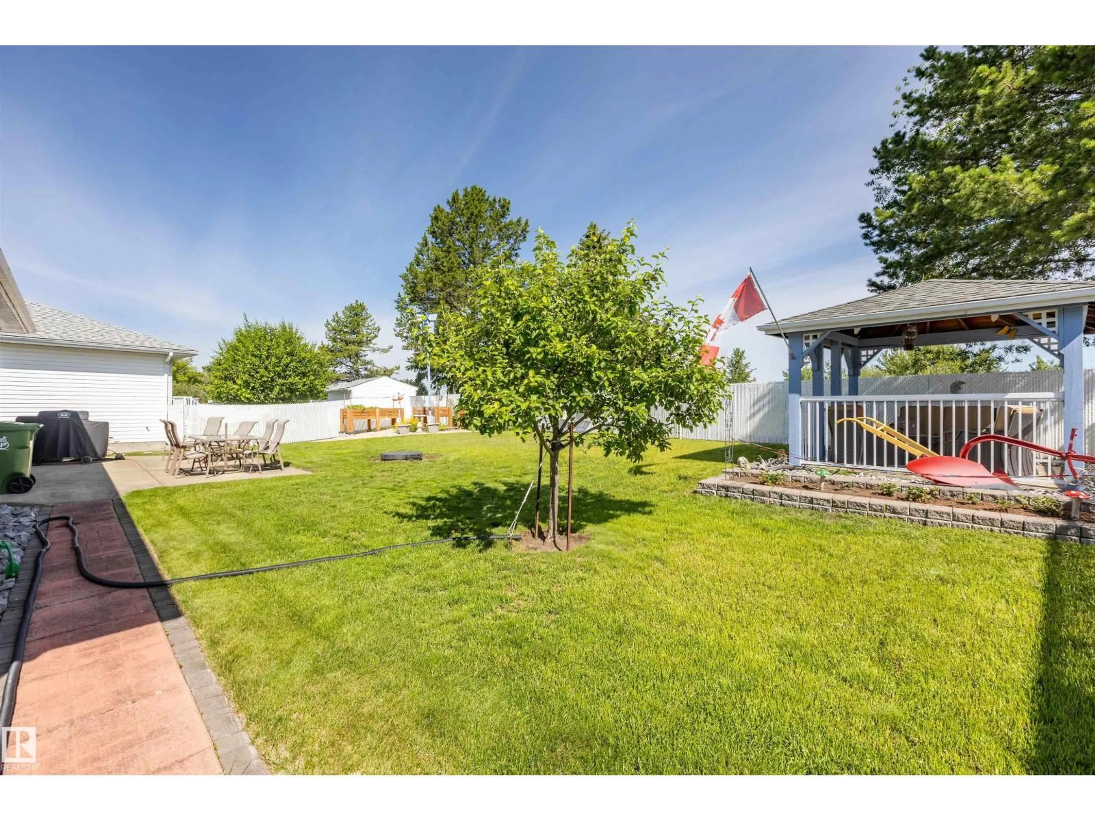 A pic from outside/outdoor area/front of a property/back of a property/a pic from drone, street for 8608 107 AV, Morinville Alberta T8R1C2