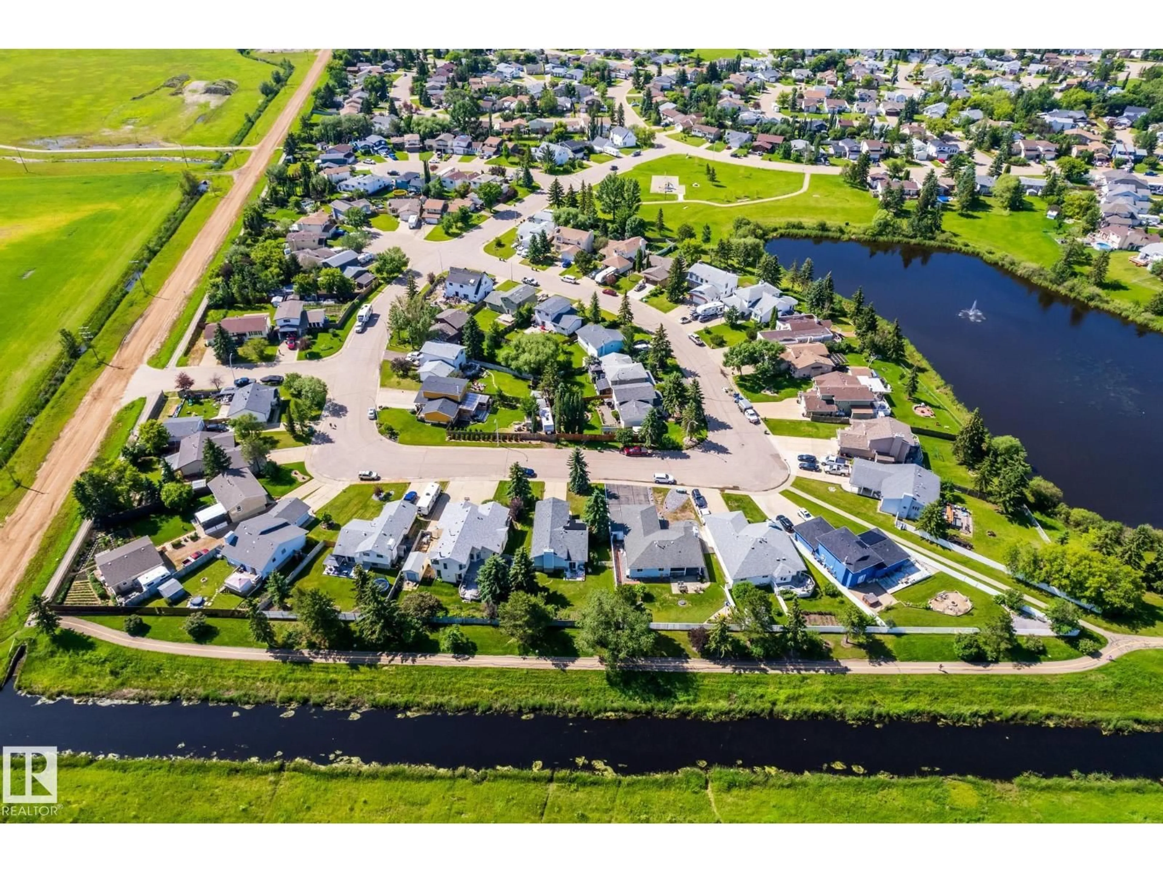 A pic from outside/outdoor area/front of a property/back of a property/a pic from drone, water/lake/river/ocean view for 8608 107 AV, Morinville Alberta T8R1C2