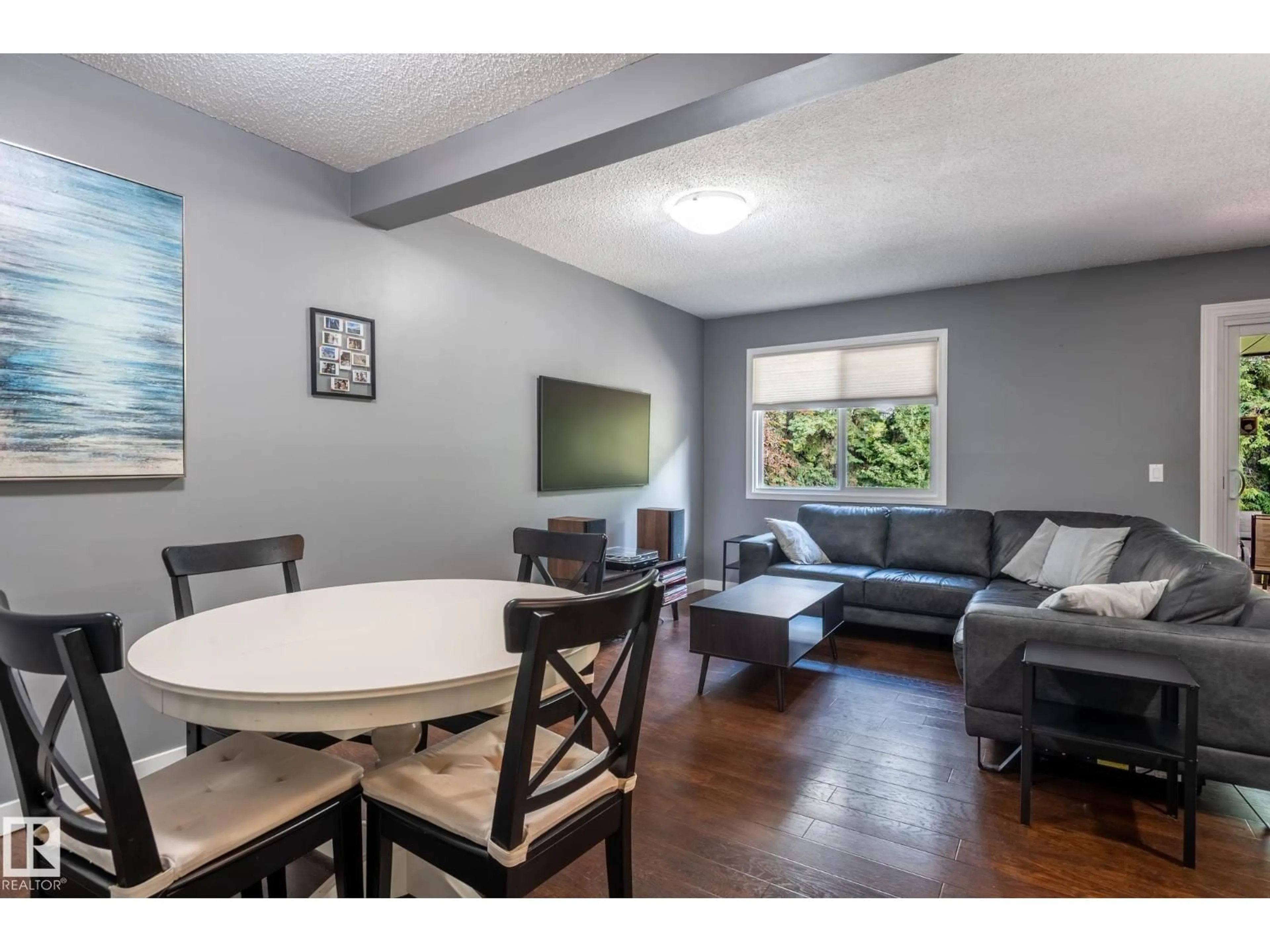 Living room with furniture, wood/laminate floor for 100 FOREST GV, St. Albert Alberta T8N3K6