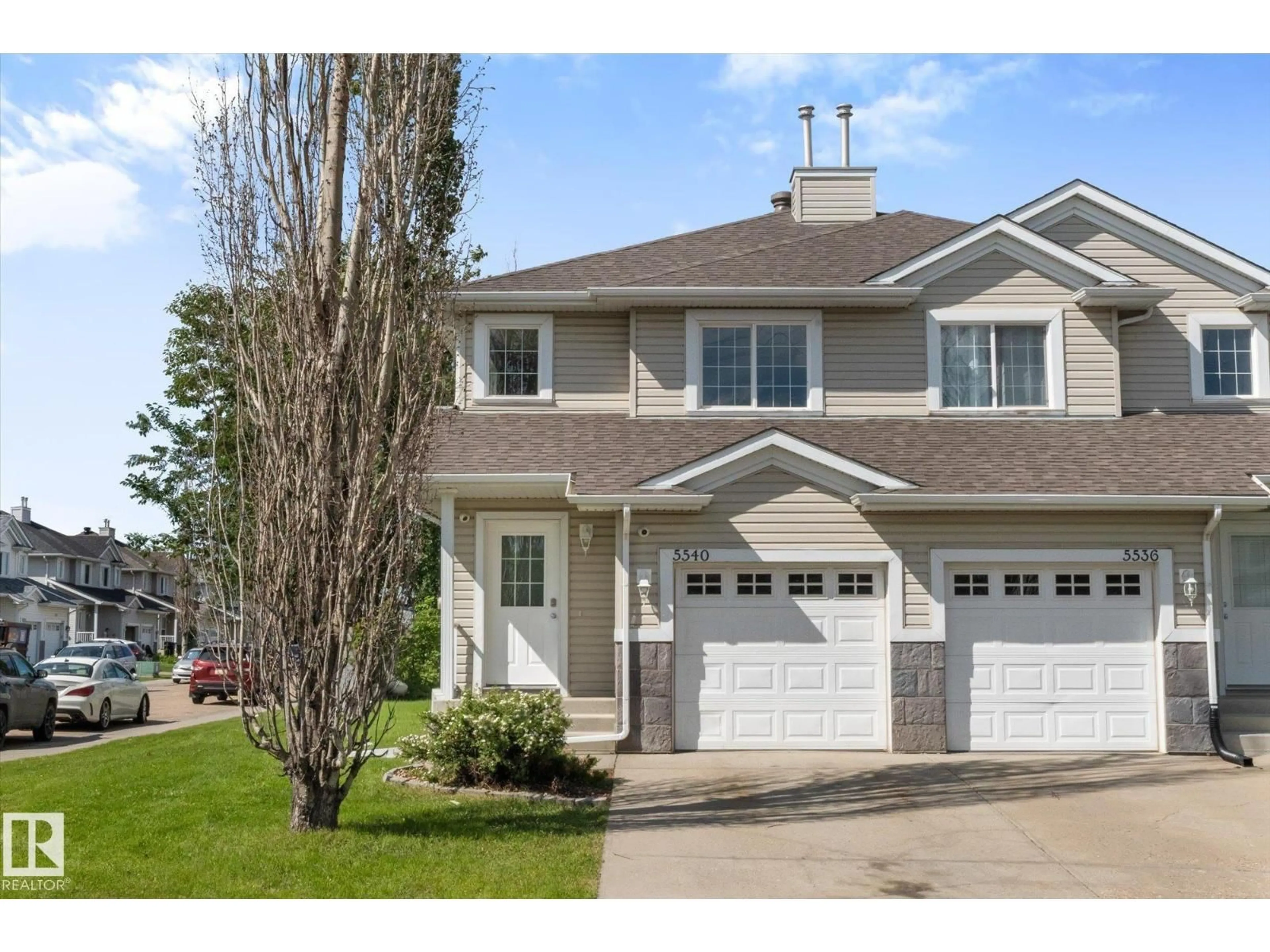 Home with vinyl exterior material, street for 5540 163 AV, Edmonton Alberta T5Y3L3