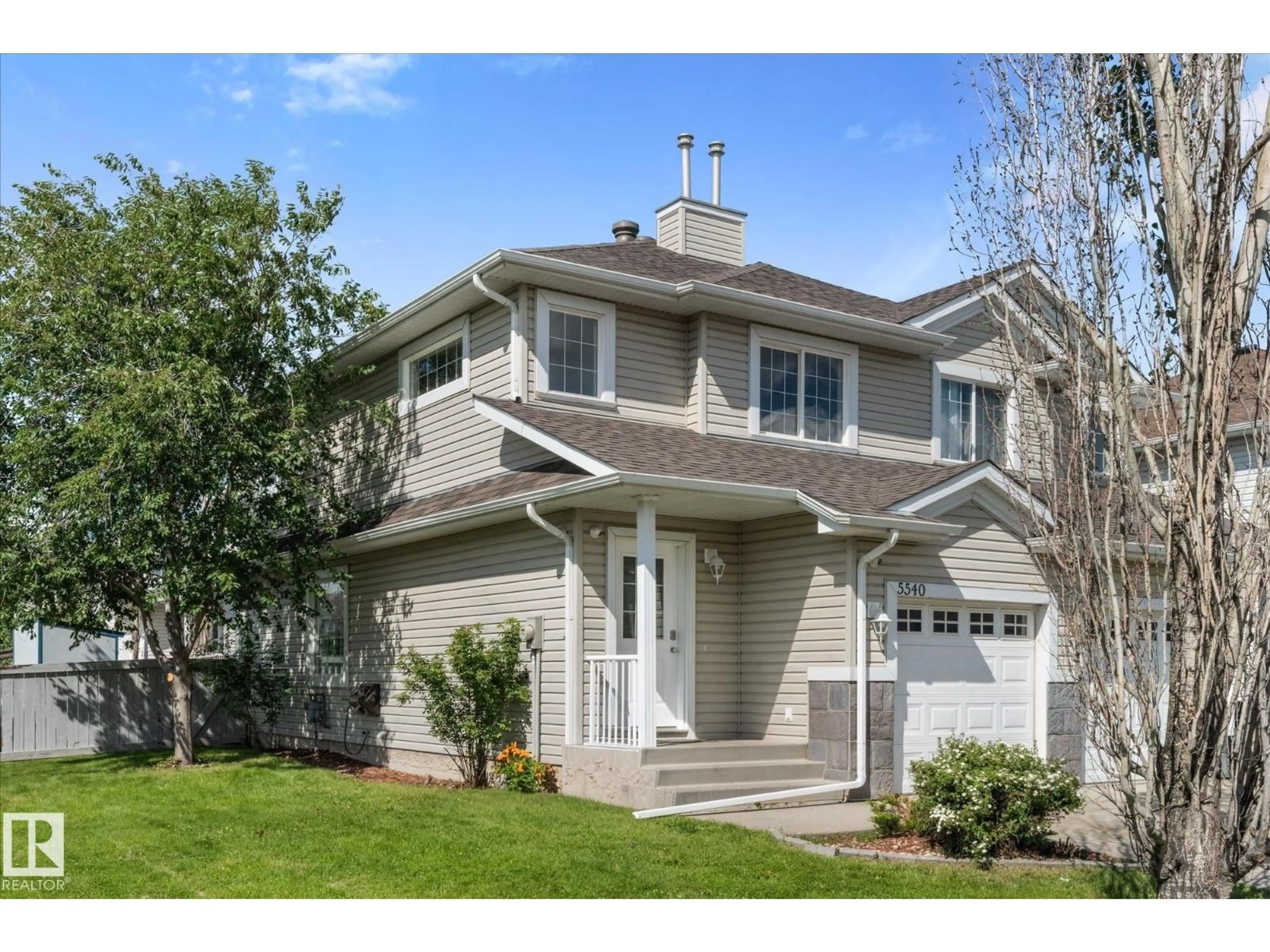 Home with vinyl exterior material, street for 5540 163 AV, Edmonton Alberta T5Y3L3
