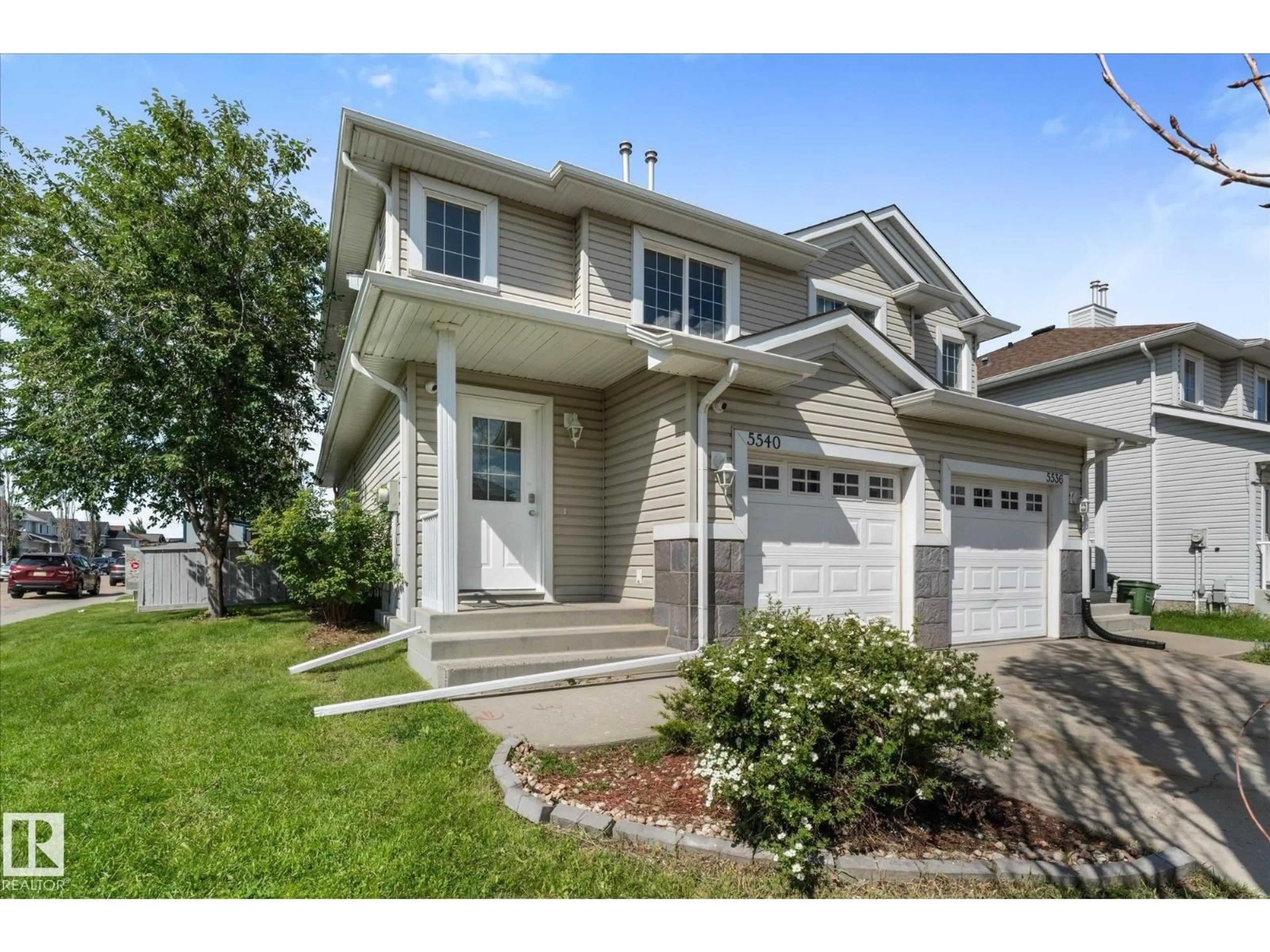 Home with vinyl exterior material, street for 5540 163 AV, Edmonton Alberta T5Y3L3