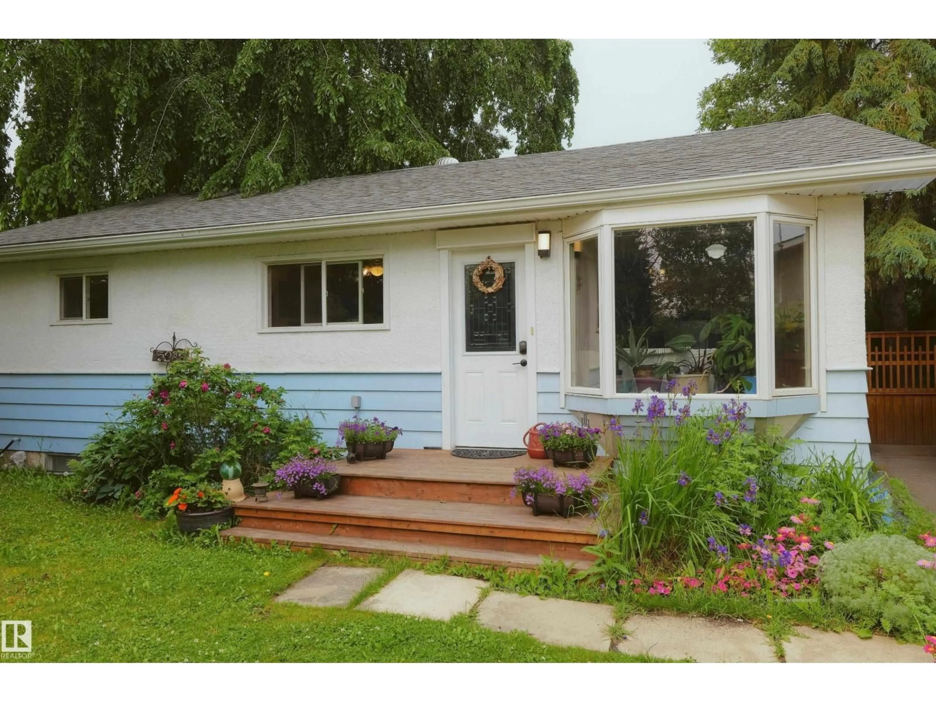 Home with vinyl exterior material, street for 5212 43 STREET, Barrhead Alberta T7N1J7