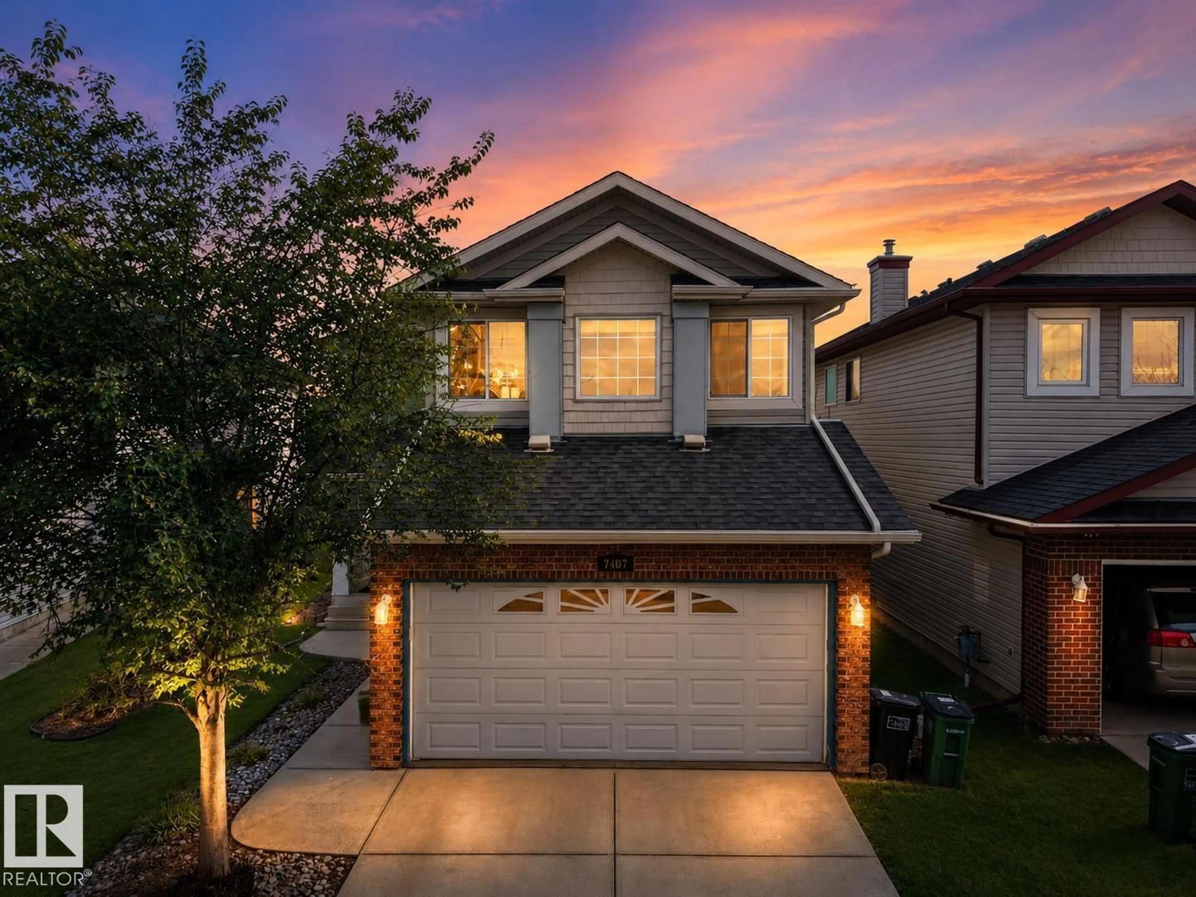 Home with vinyl exterior material, street for NW - 7407 SINGER LD, Edmonton Alberta T6R3S2