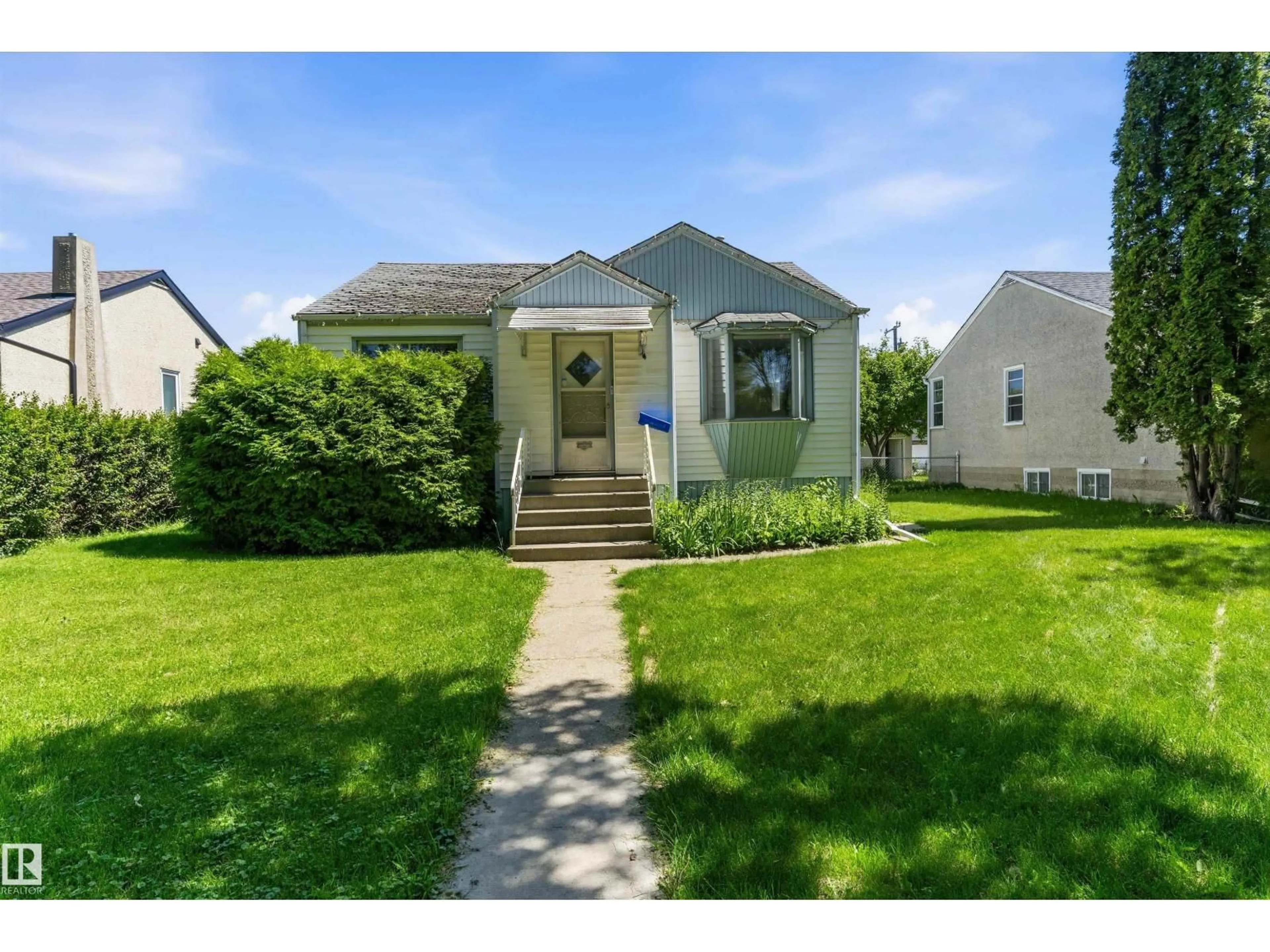 Home with vinyl exterior material, street for NW - 11619 123 ST, Edmonton Alberta T5M0G7
