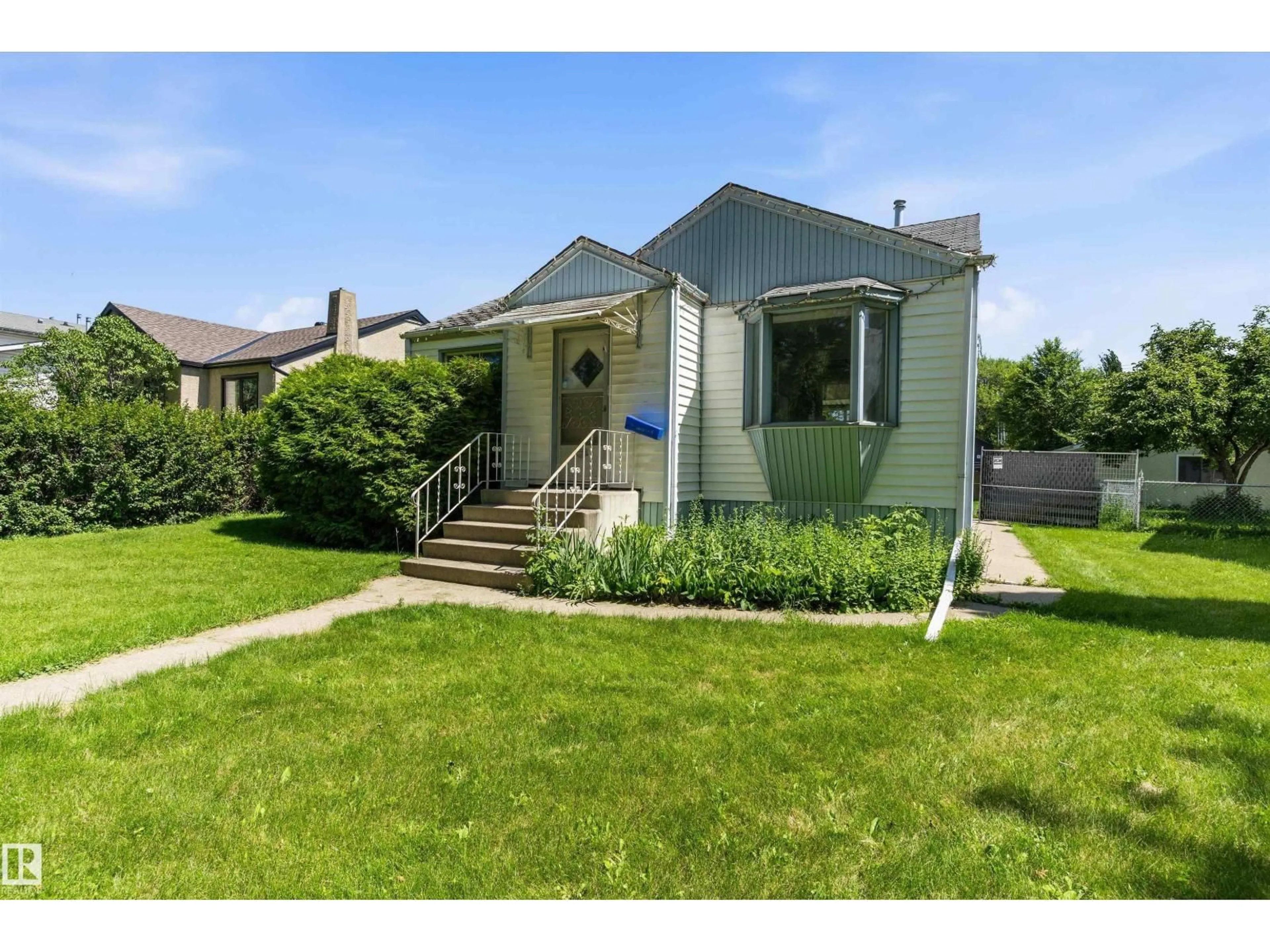 Home with vinyl exterior material, street for NW - 11619 123 ST, Edmonton Alberta T5M0G7