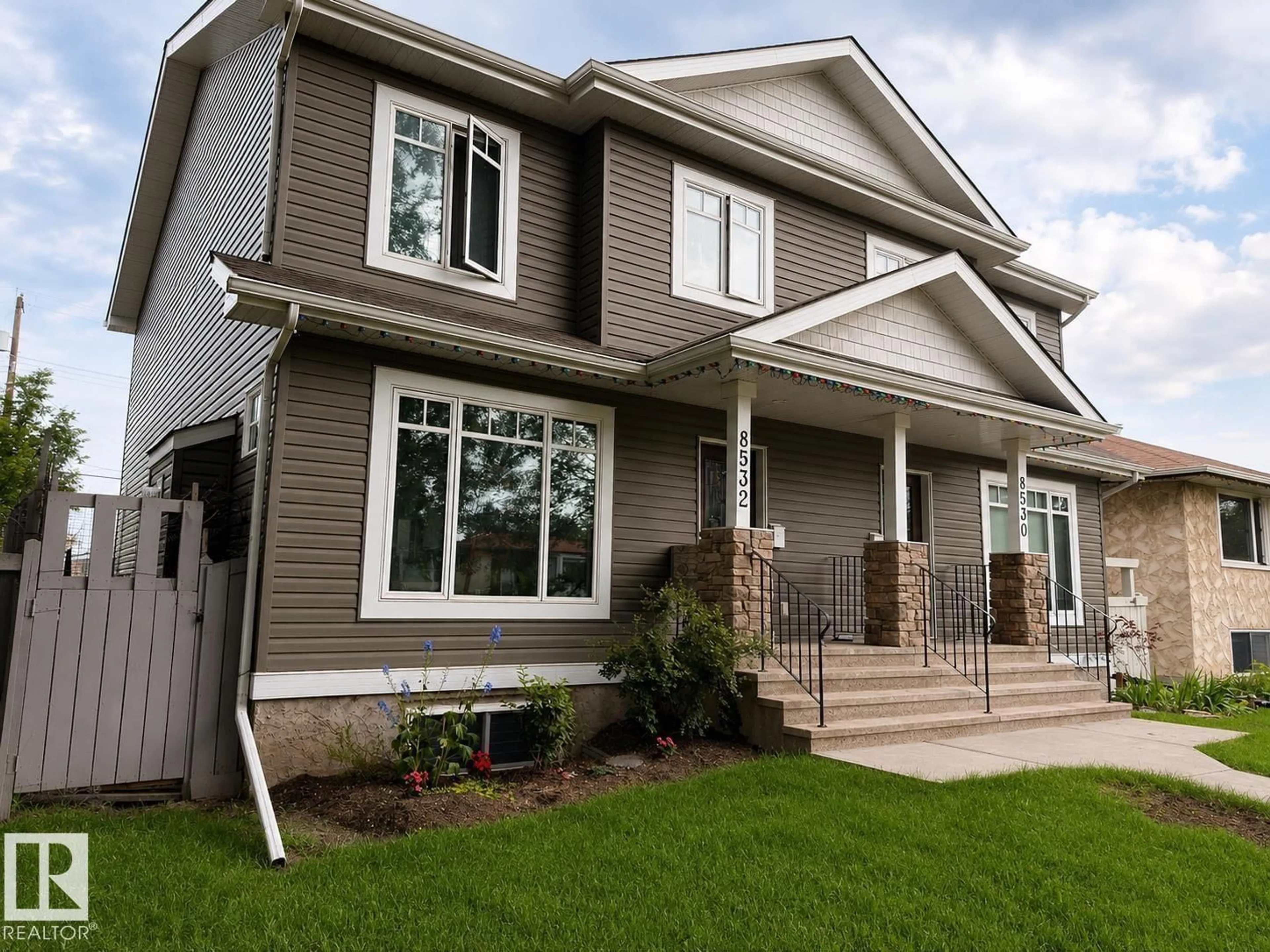 Home with vinyl exterior material, street for 8530 76 AV, Edmonton Alberta T6J0J3