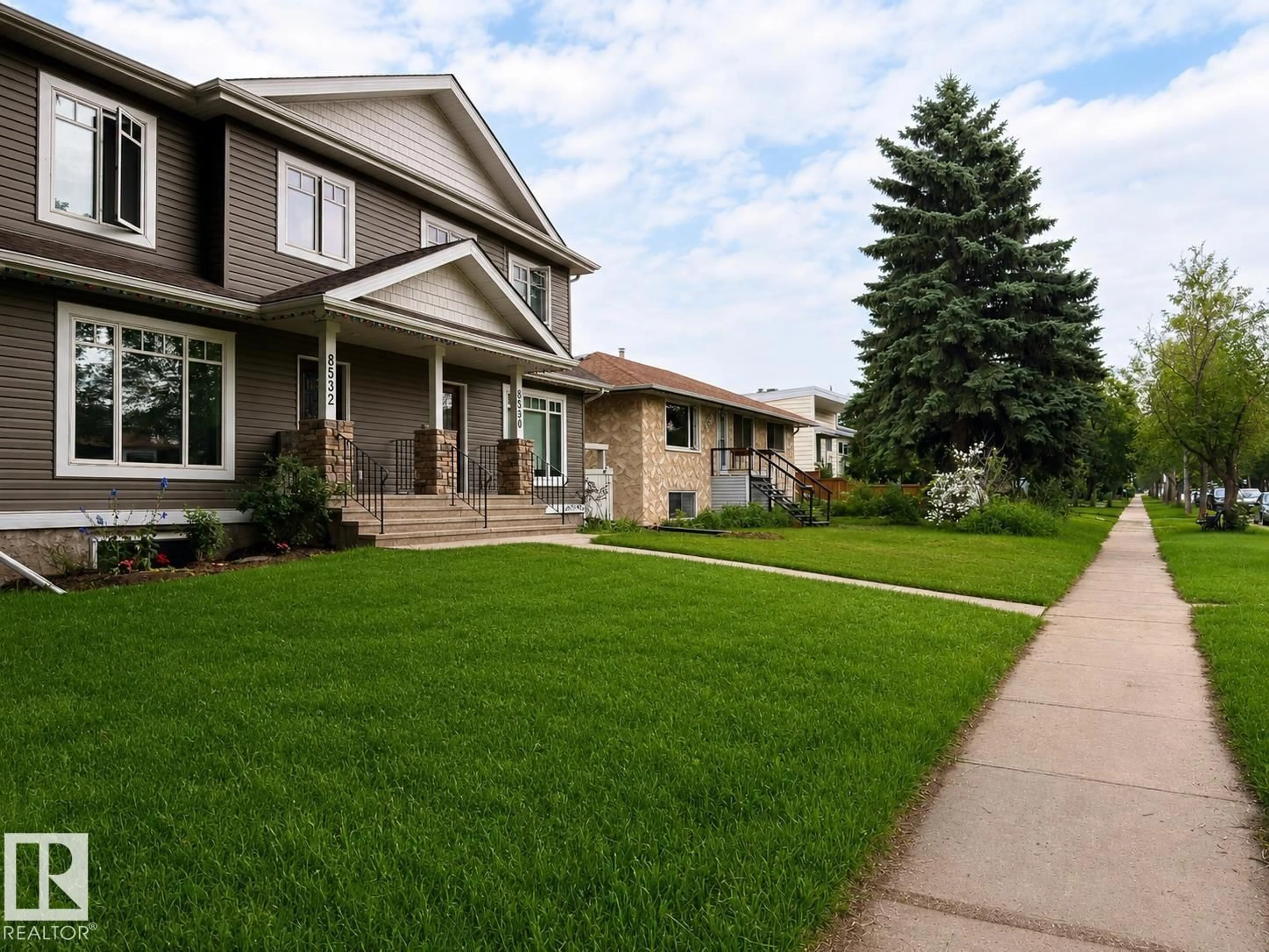 Home with vinyl exterior material, street for 8530 76 AV, Edmonton Alberta T6J0J3