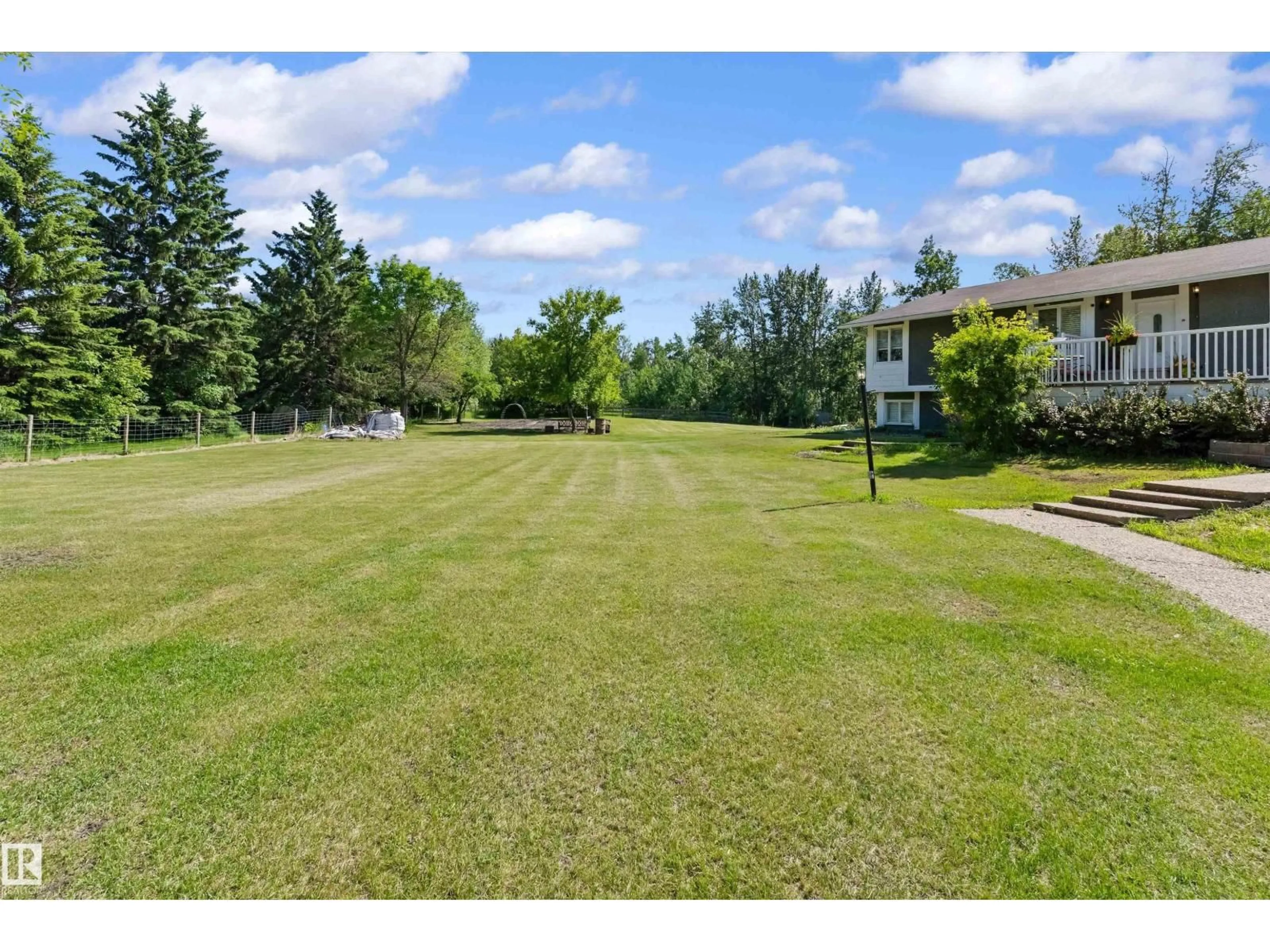 A pic from outside/outdoor area/front of a property/back of a property/a pic from drone, water/lake/river/ocean view for 29 TWP ROAD 512 A, Rural Parkland County Alberta T7Y1A8