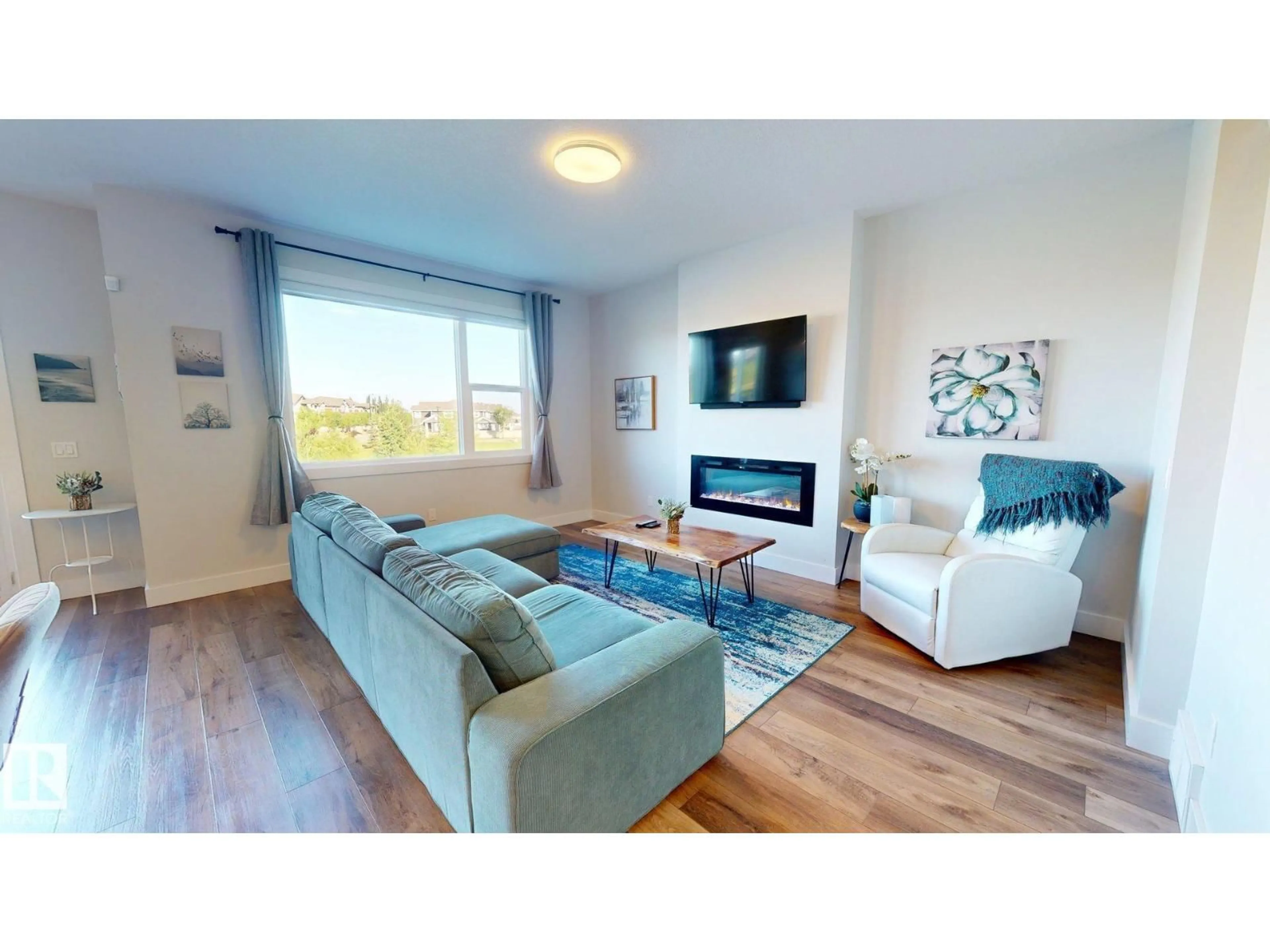 Living room with furniture, wood/laminate floor for 3805 CHERRY LO, Edmonton Alberta T6X2K7