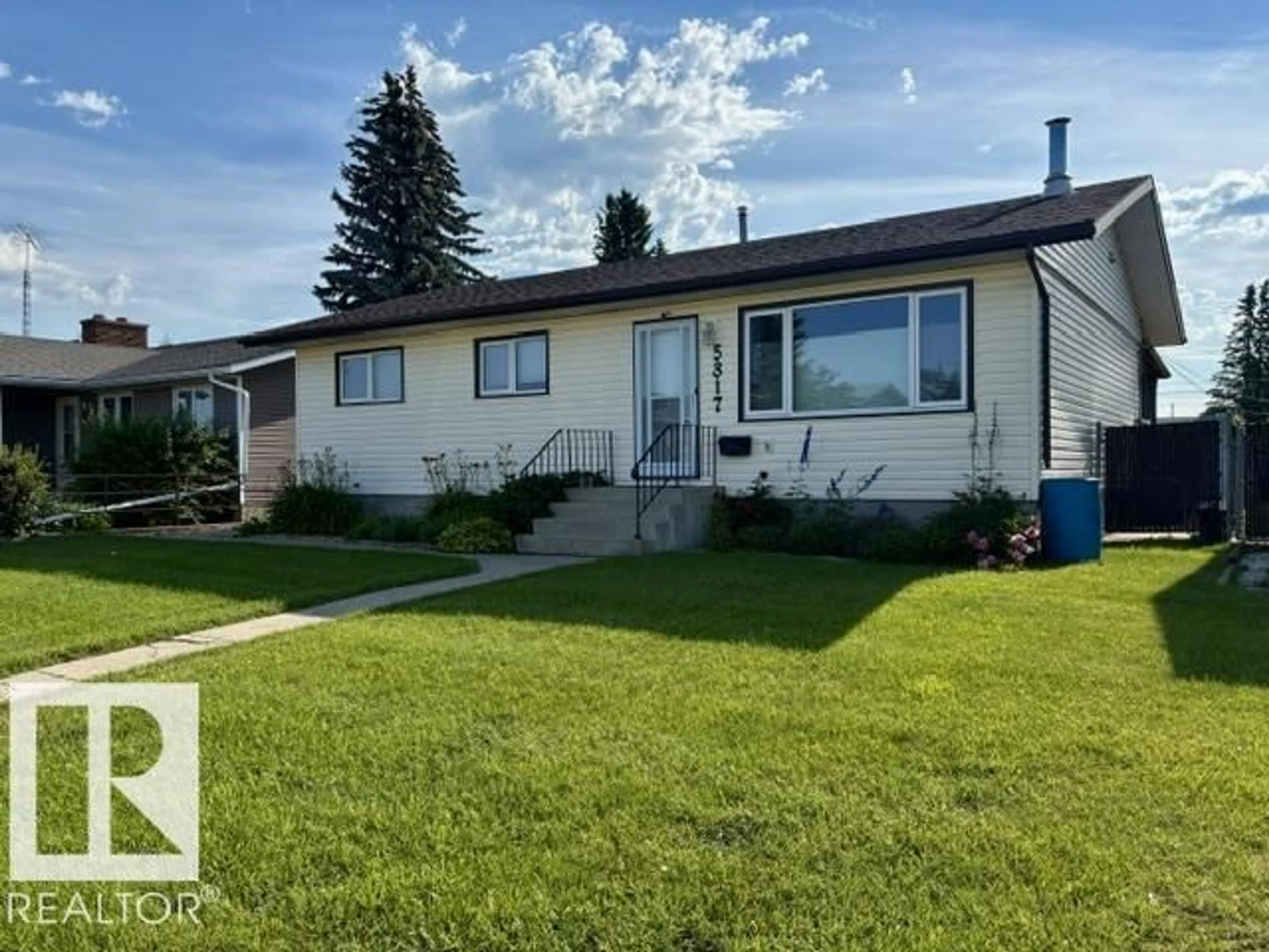 Home with vinyl exterior material, street for 5817 52 ST, Vegreville Alberta T9C1J2