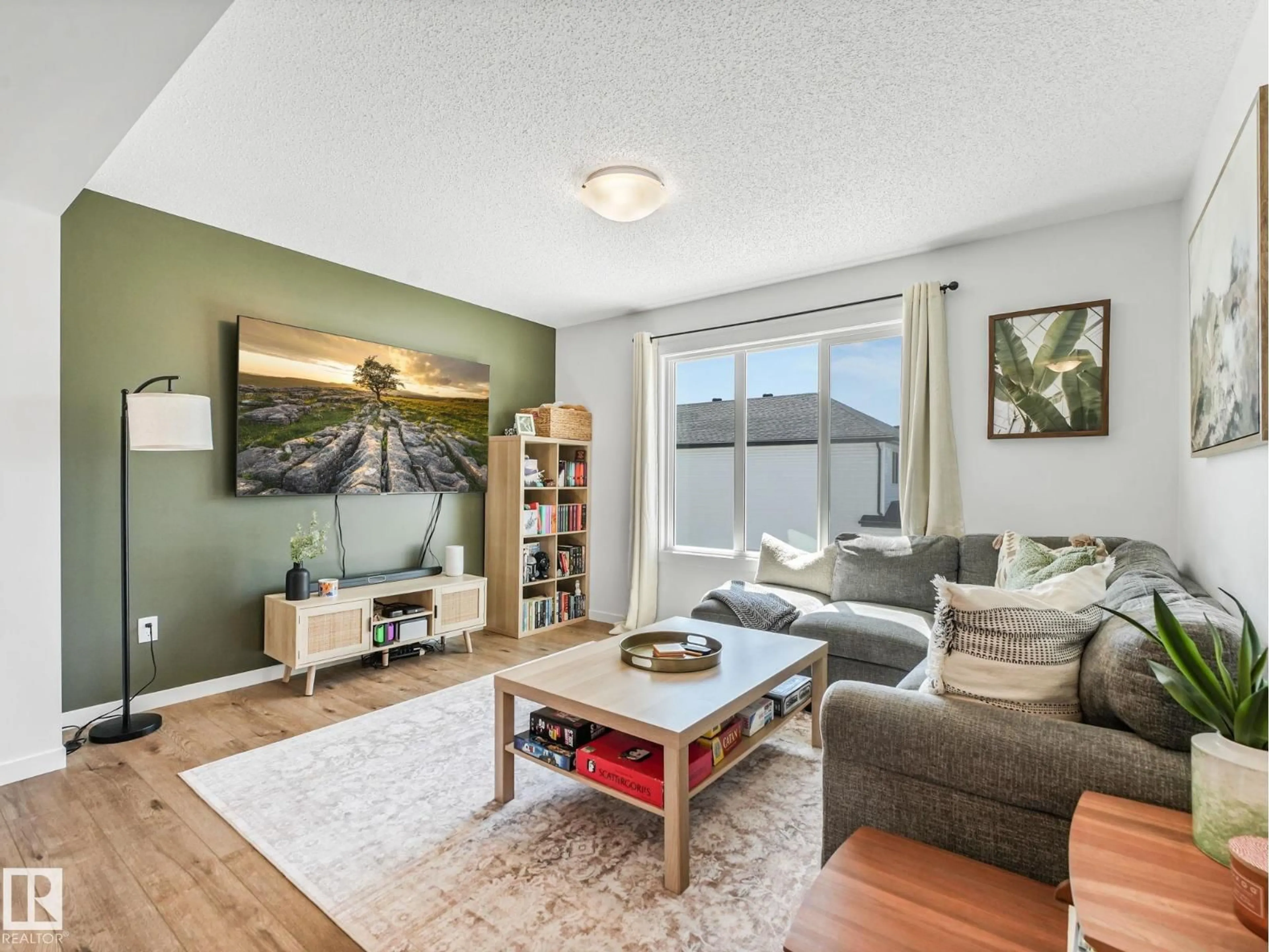 Living room with furniture, wood/laminate floor for 257 MARQUIS BV, Edmonton Alberta T5Y4E7