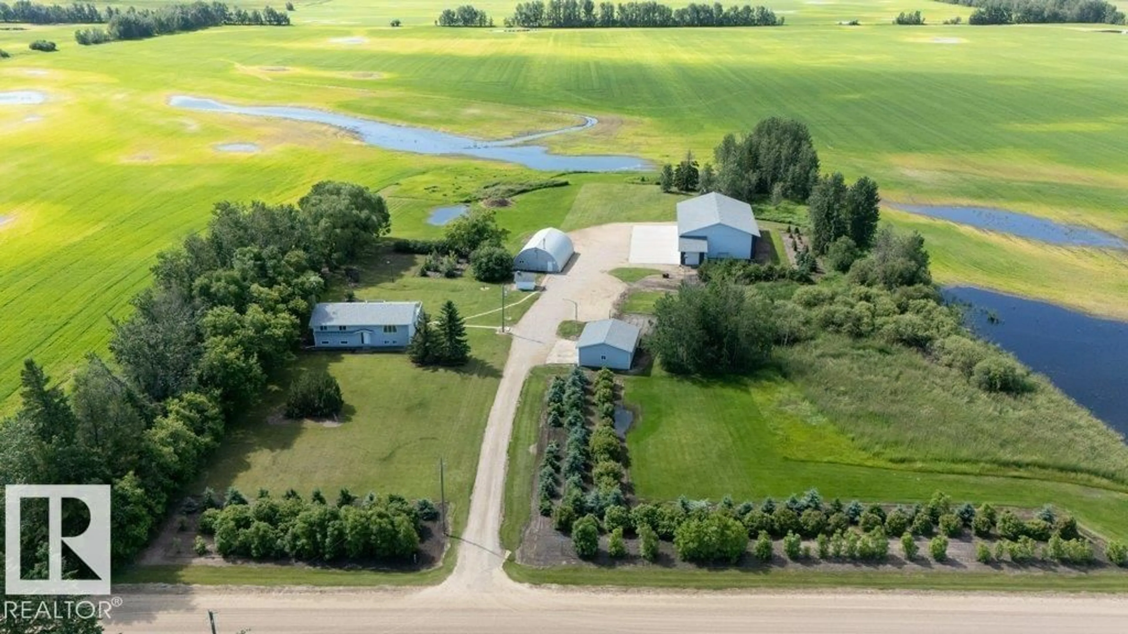 A pic from outside/outdoor area/front of a property/back of a property/a pic from drone, water/lake/river/ocean view for 25023 TWP RD 612, Rural Westlock County Alberta T0G1S0