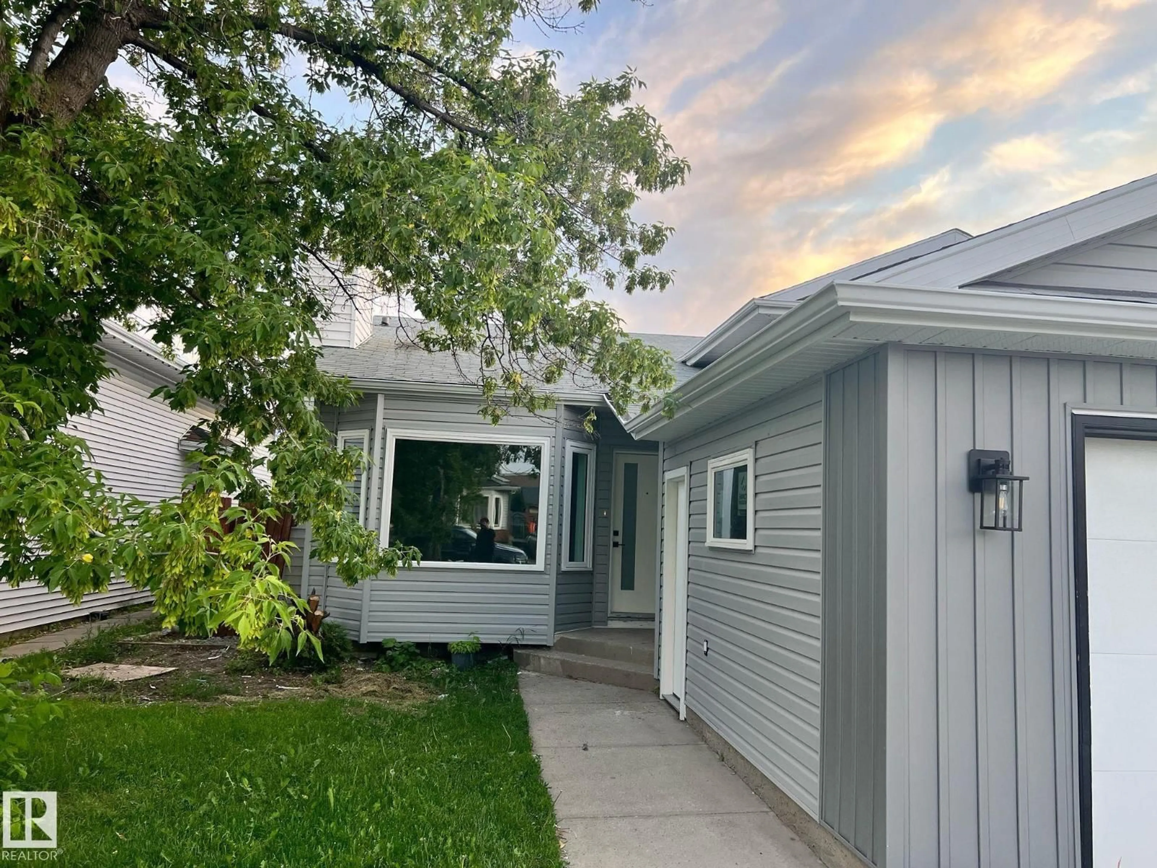 Home with vinyl exterior material, street for 3320 43 ST, Edmonton Alberta T6L6A4