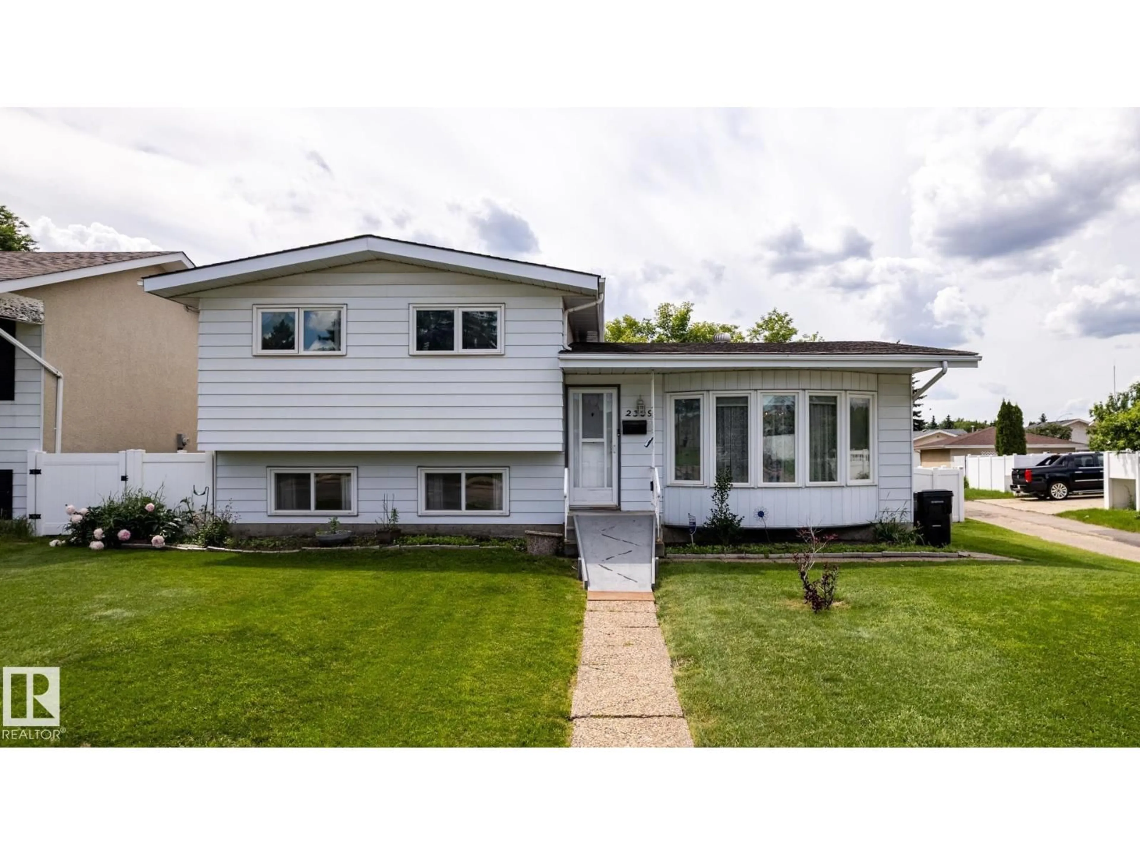 Home with vinyl exterior material, street for 2309 MILLBOURNE RD, Edmonton Alberta T6K1E2