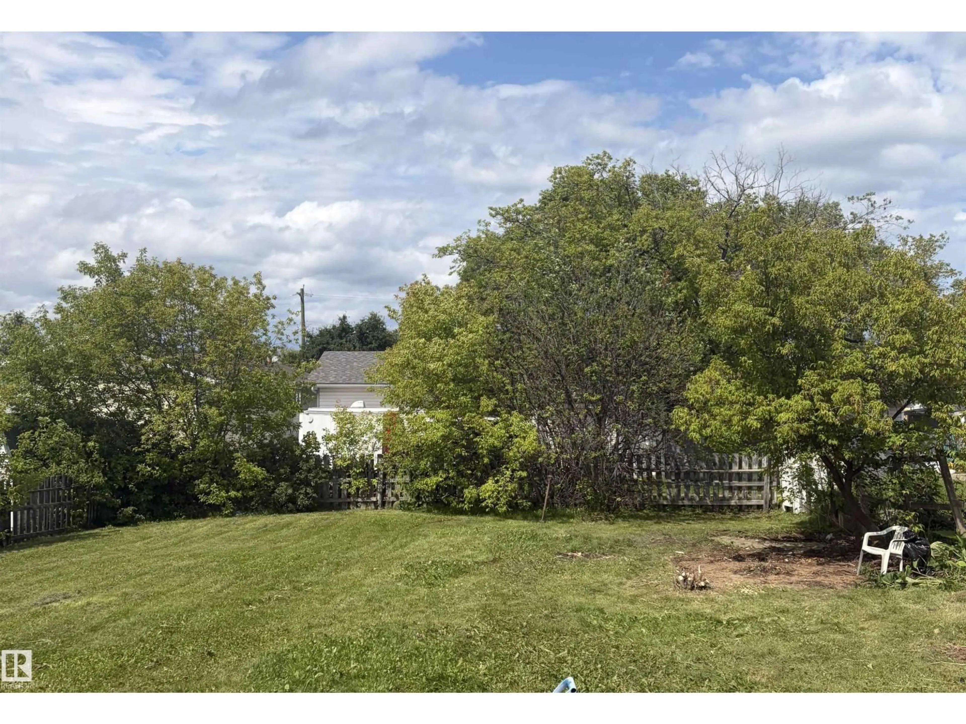 A pic from outside/outdoor area/front of a property/back of a property/a pic from drone, forest/trees view for 820 16 AV, Cold Lake Alberta T0A0V4